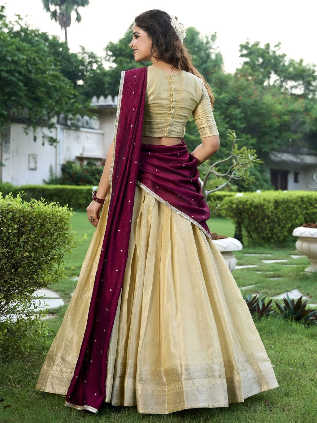 Cream kanchipuram silk lehenga choli with zari weaving and sequins embroidery