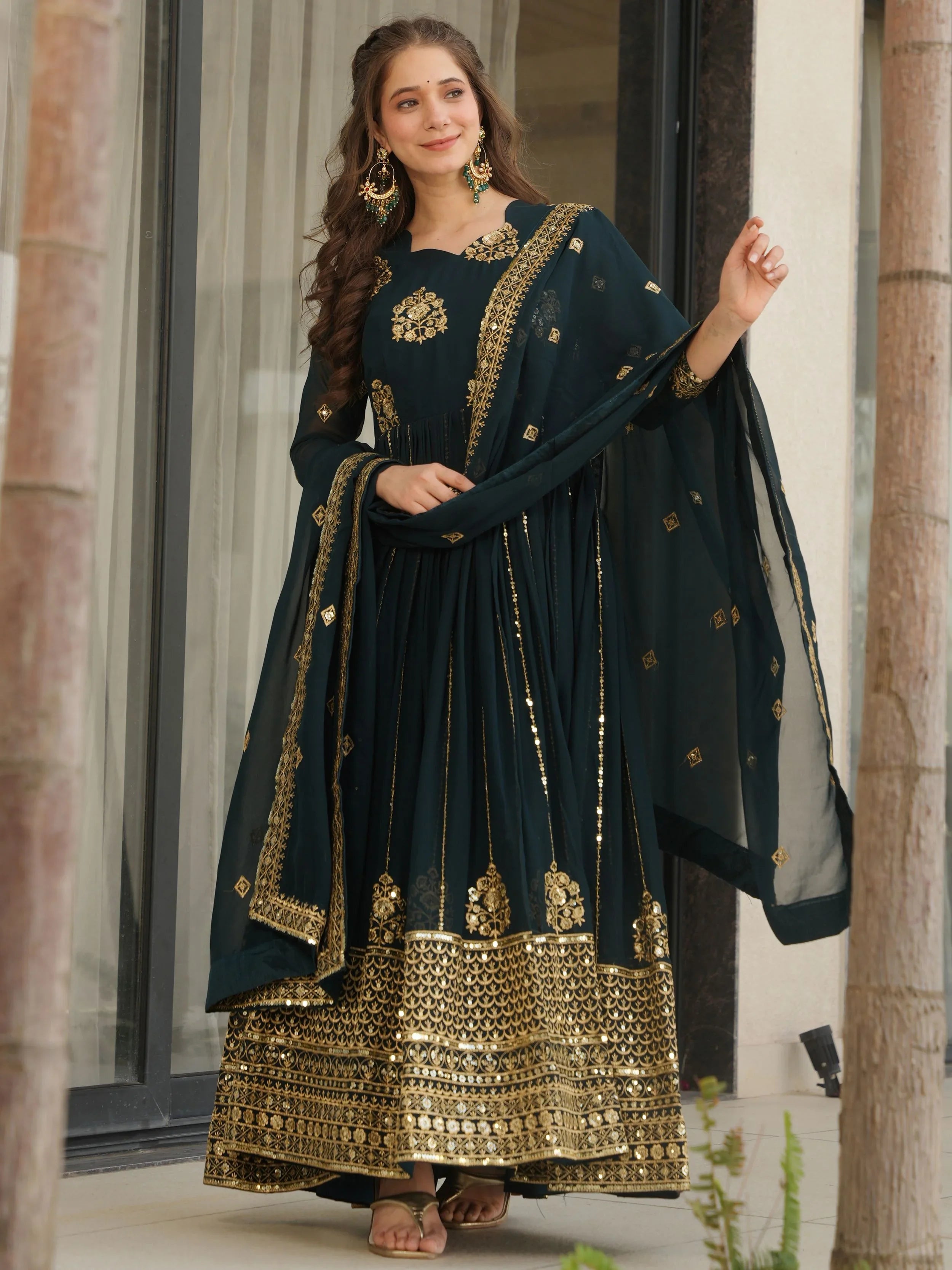 Emerald green georgette gown with zari and sequins embroidery and dupatta