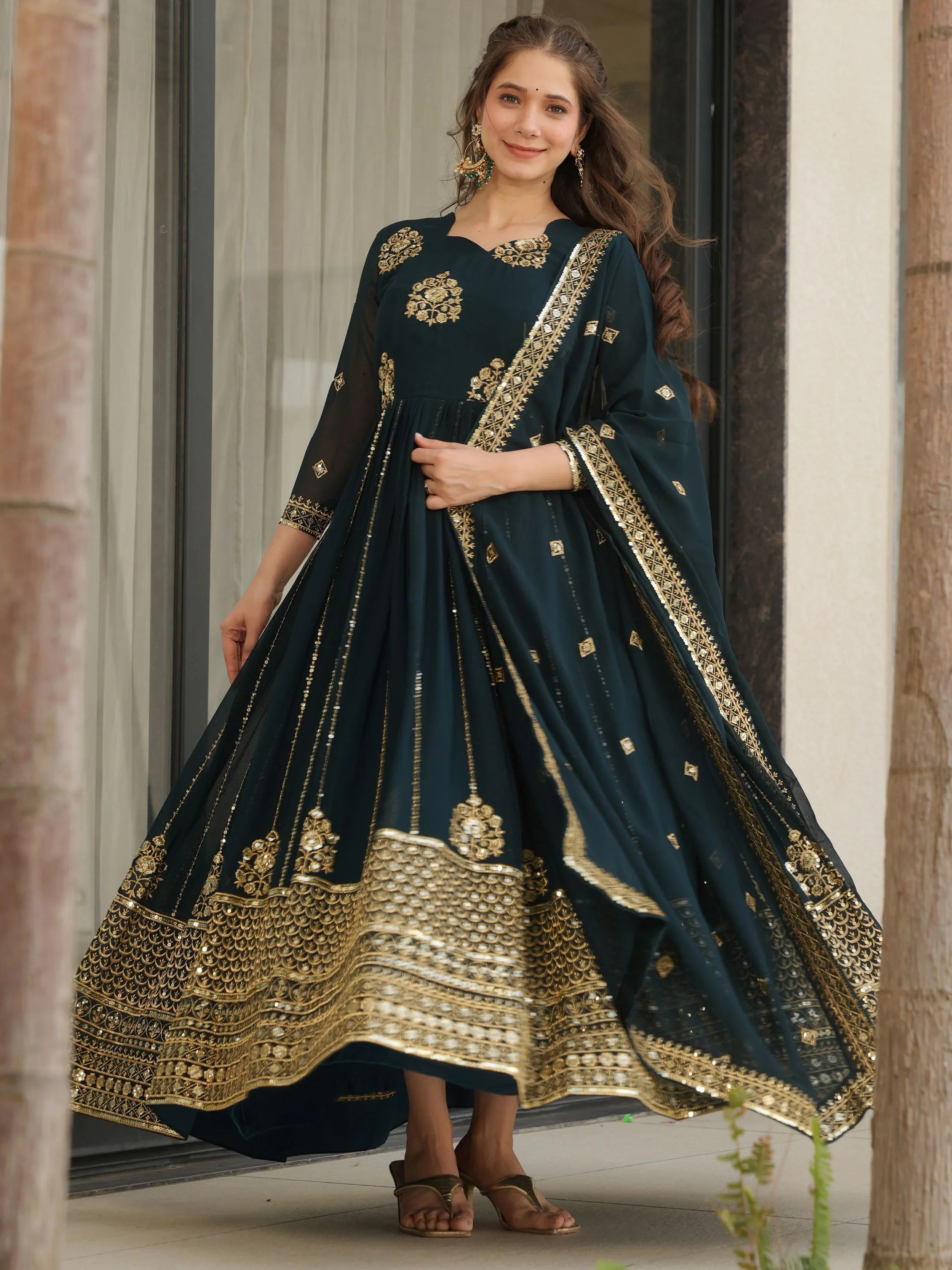 Emerald green georgette gown with zari and sequins embroidery and dupatta