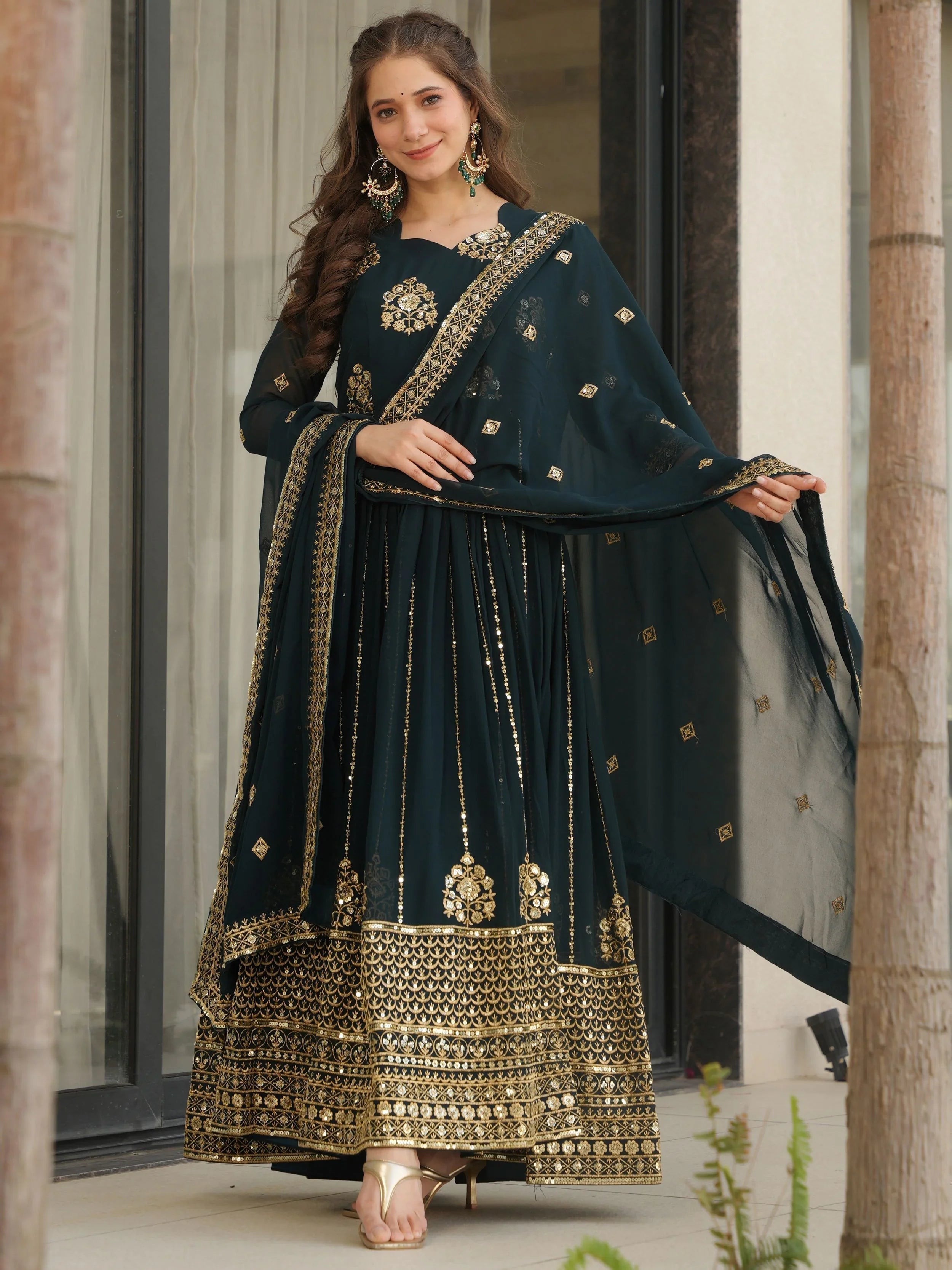 Emerald green georgette gown with zari and sequins embroidery and dupatta