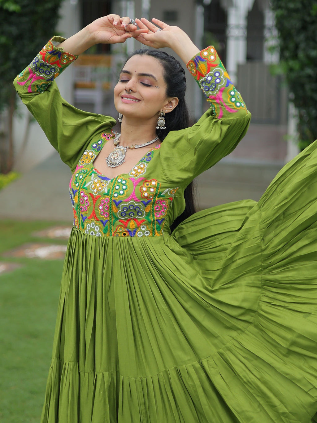Green rayon flair gown with kutchi gamthi work for navratri