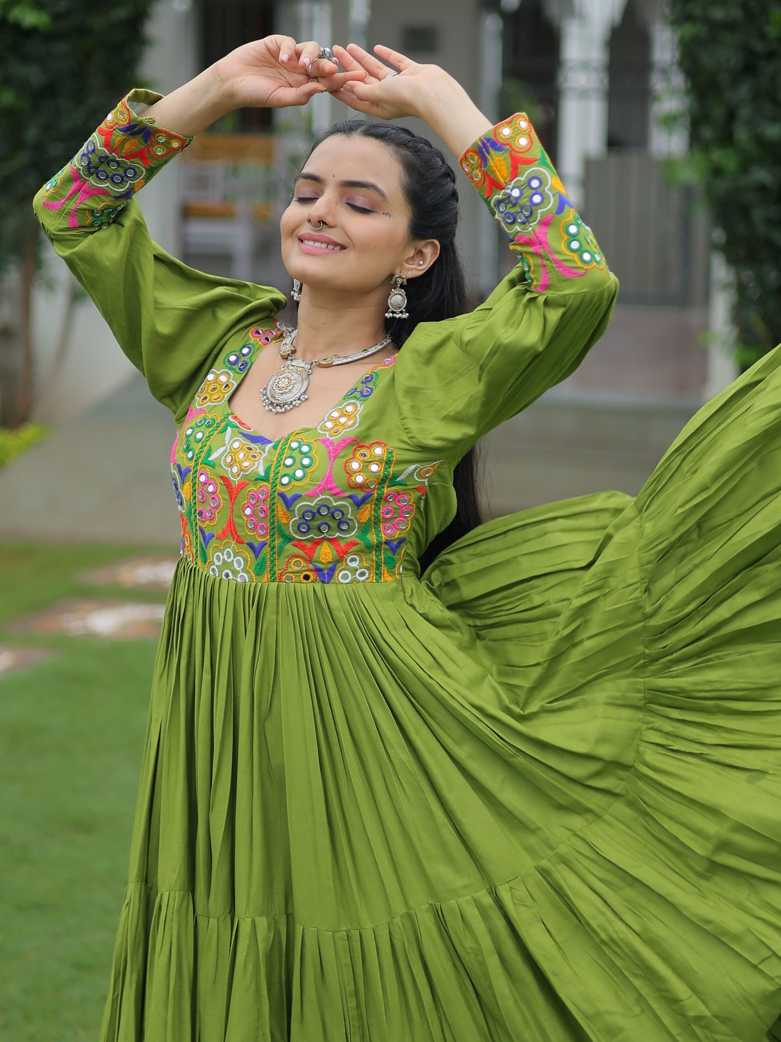 Green rayon flair gown with kutchi gamthi work for navratri