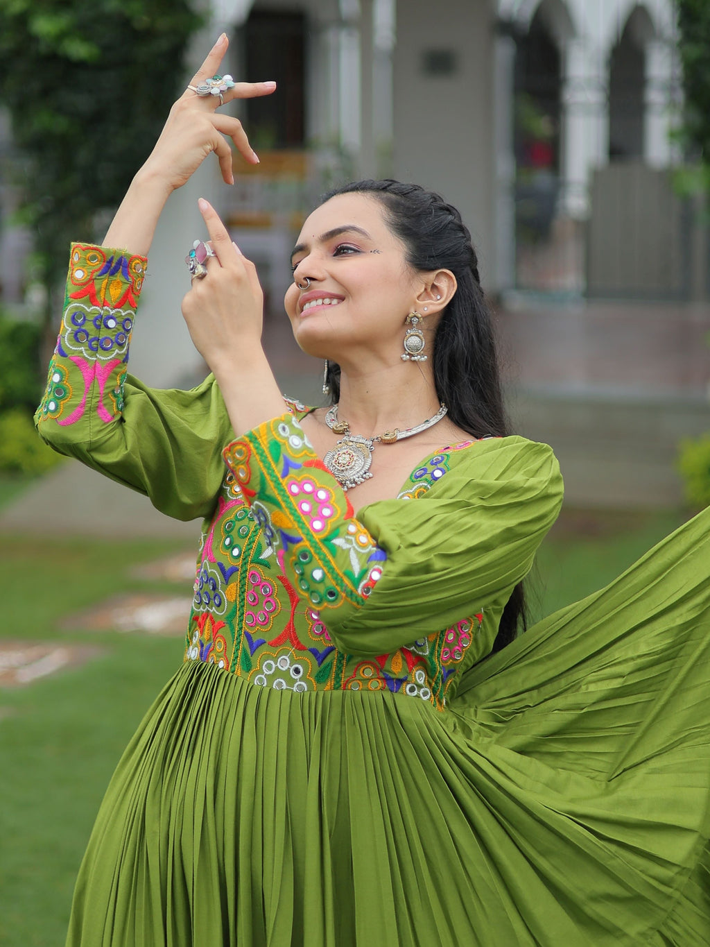 Green rayon flair gown with kutchi gamthi work for navratri