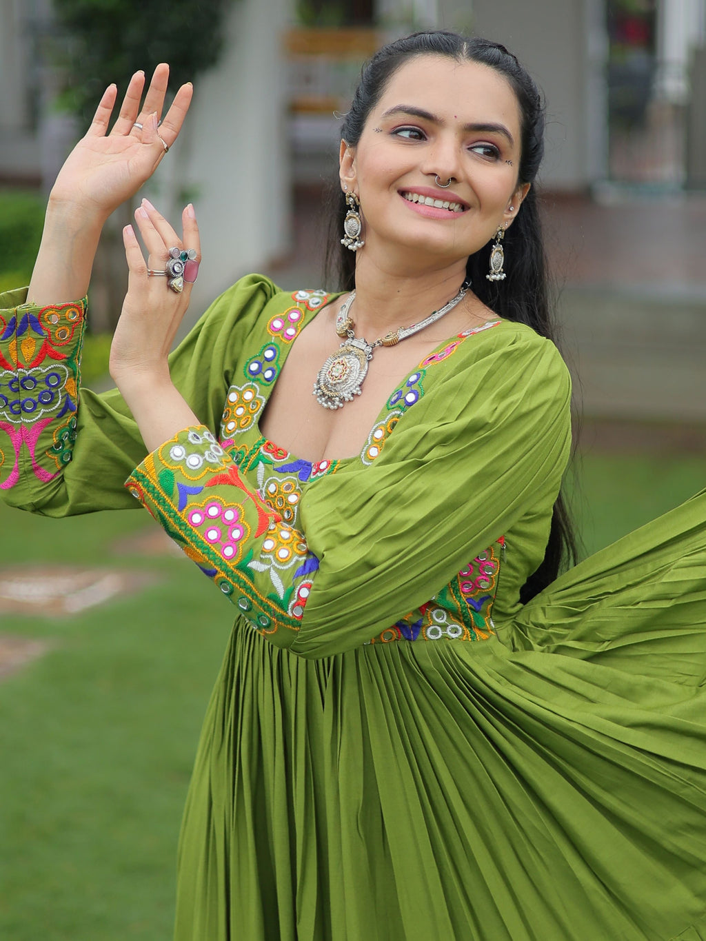 Green rayon flair gown with kutchi gamthi work for navratri