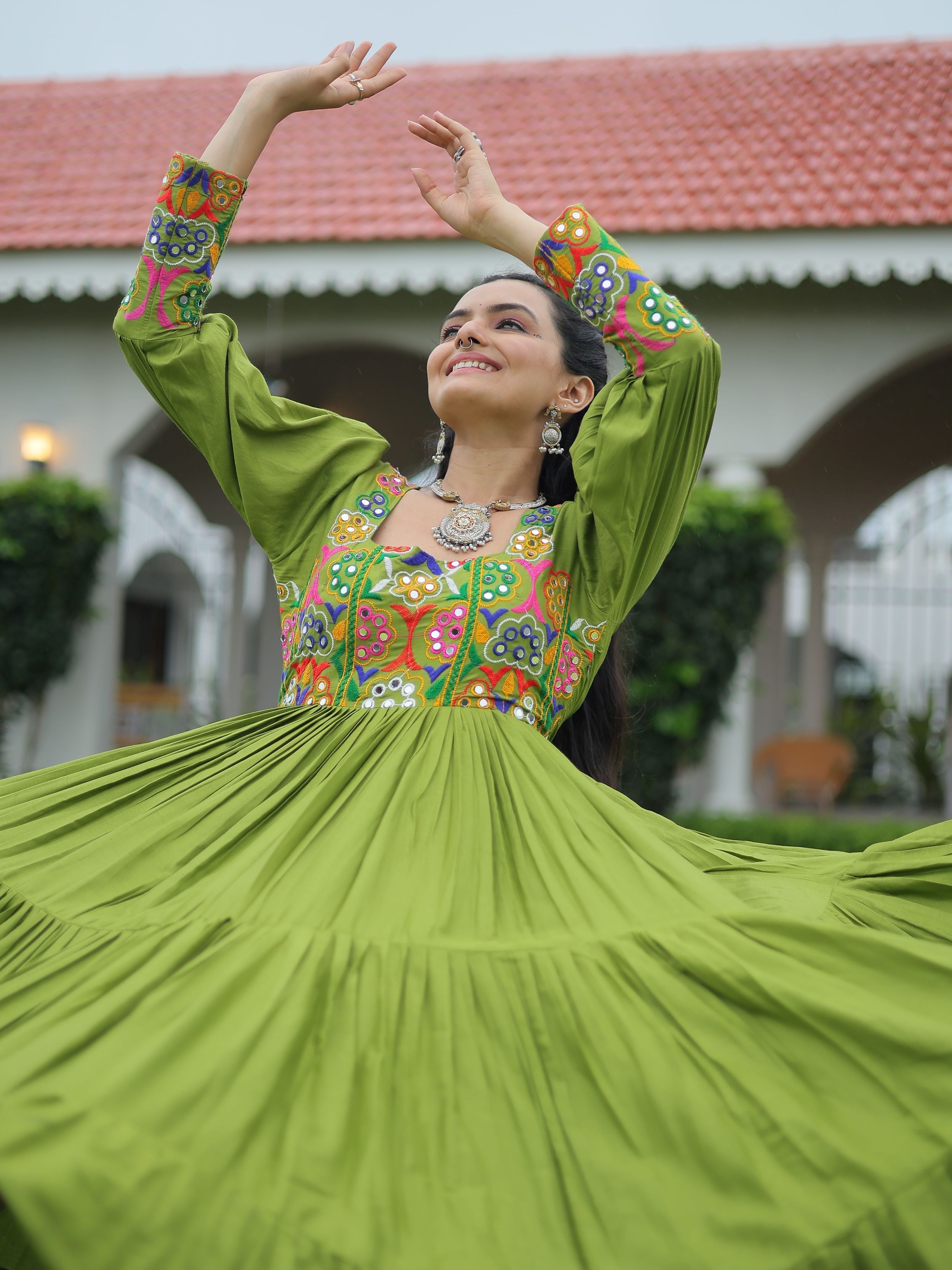 Green rayon flair gown with kutchi gamthi work for navratri
