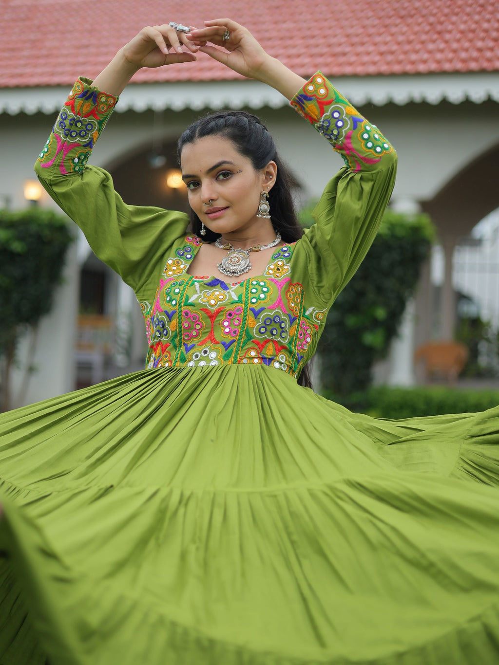 Green rayon flair gown with kutchi gamthi work for navratri