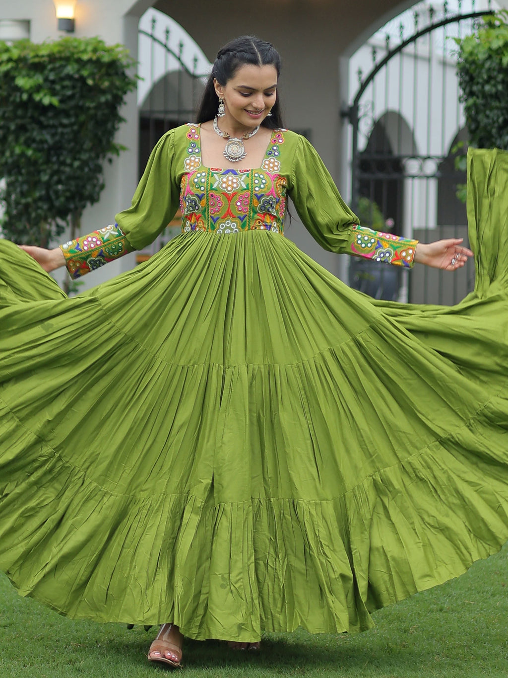 Green rayon flair gown with kutchi gamthi work for navratri