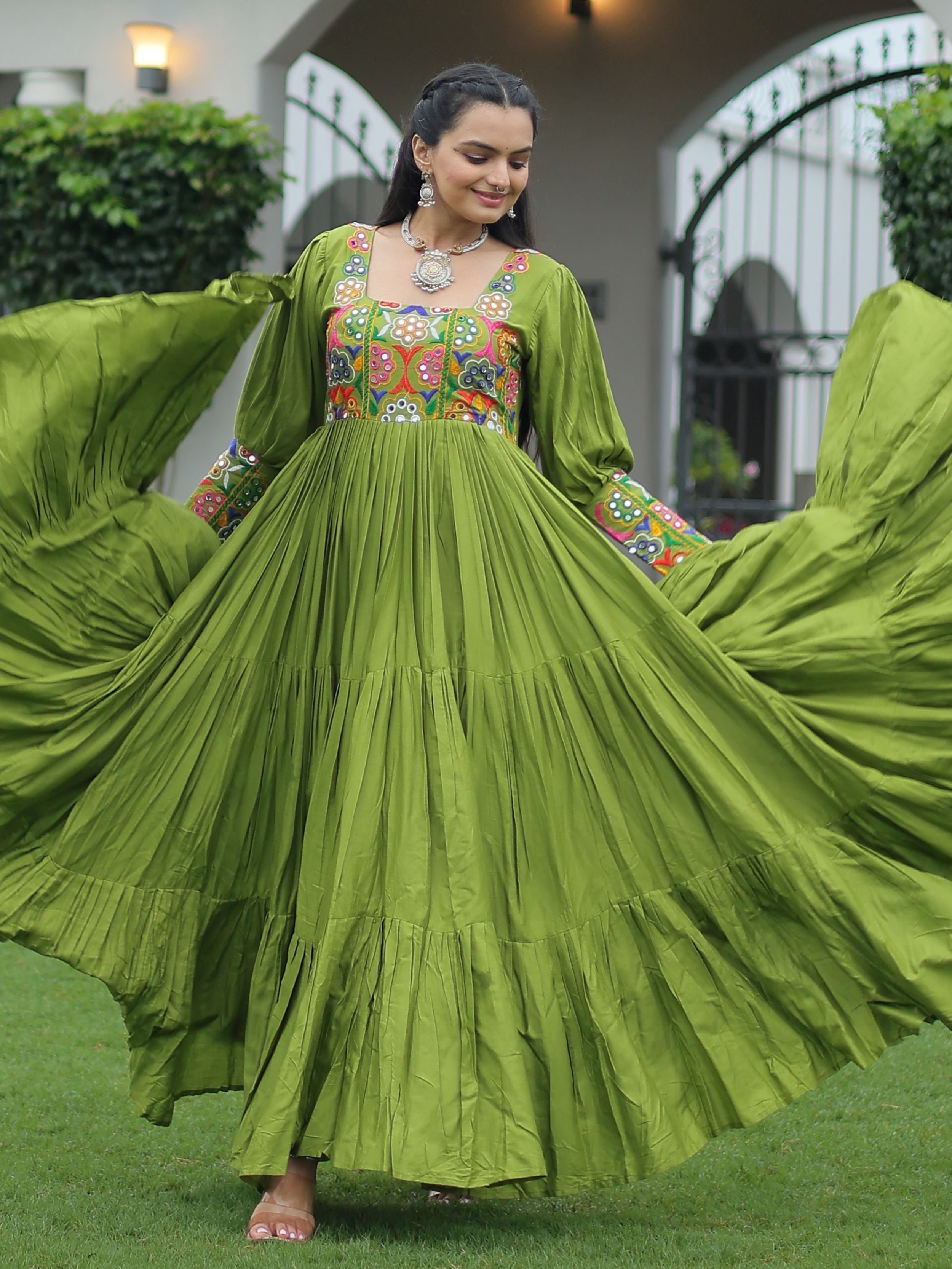 Green rayon flair gown with kutchi gamthi work for navratri
