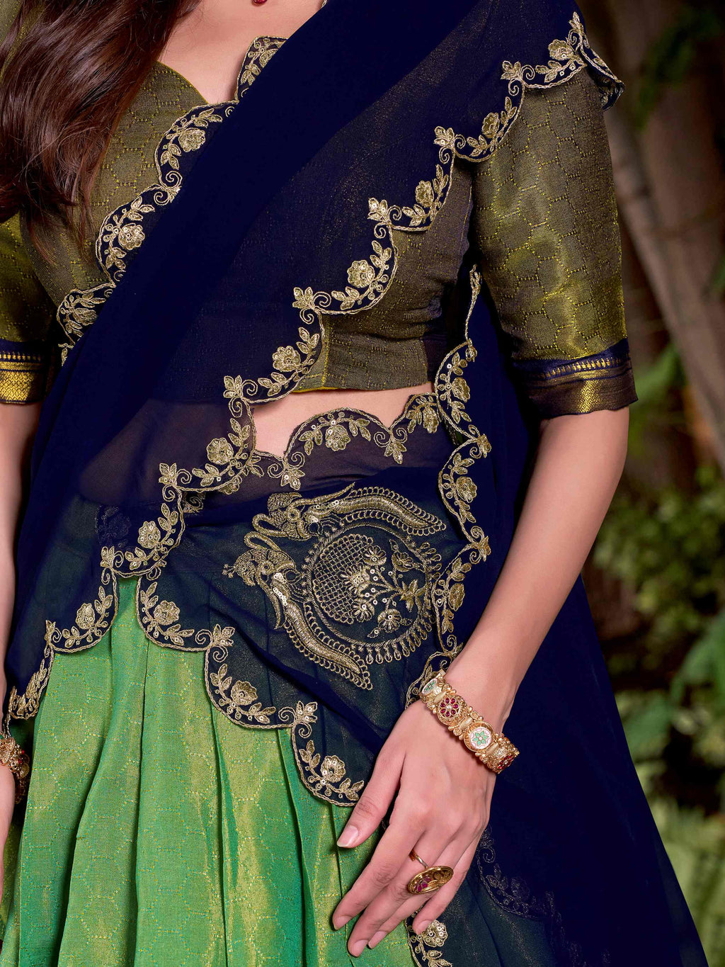 Green kanchipuram silk lehenga choli with zari weaving and sequins embroidery