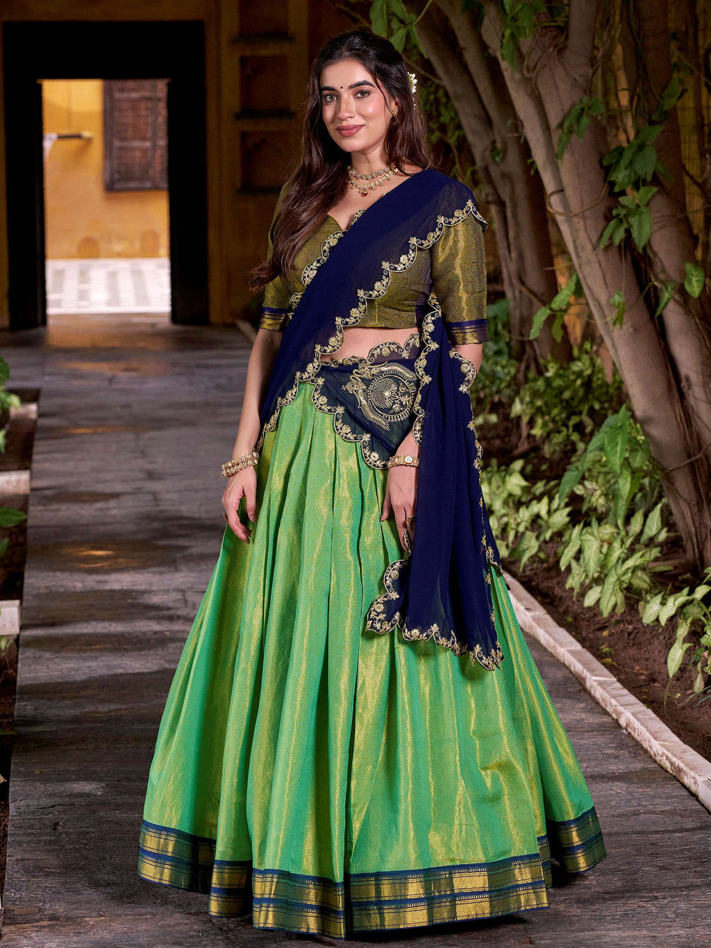 Green kanchipuram silk lehenga choli with zari weaving and sequins embroidery