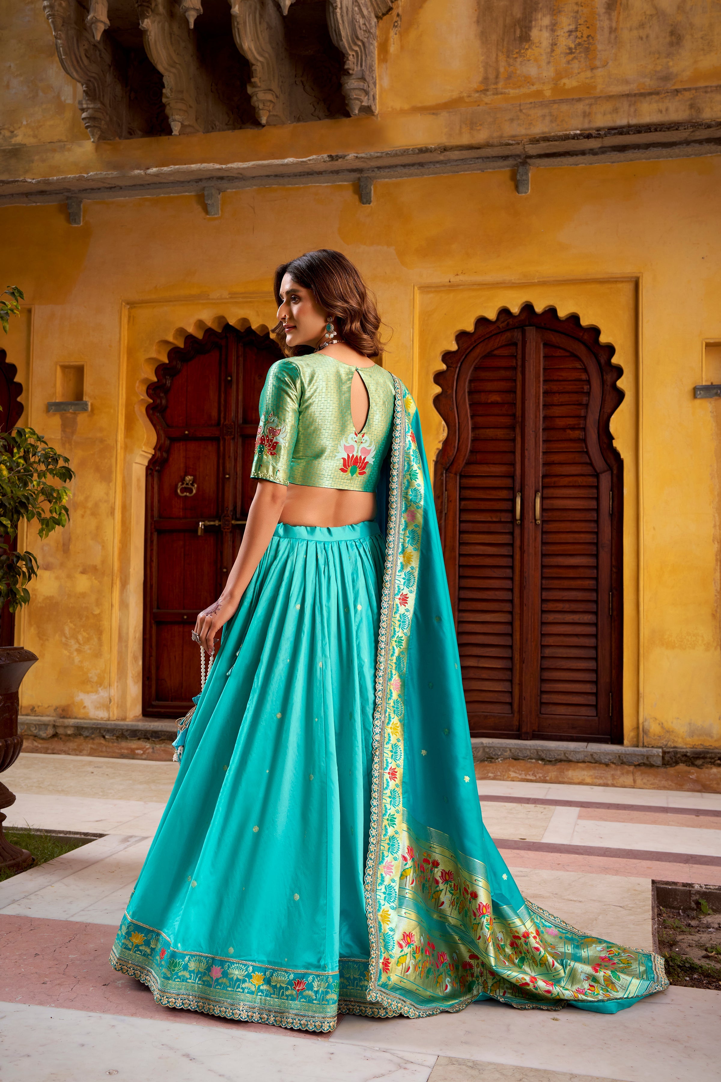 Hamsini sky blue soft silk Paithani lehenga choli with zari embroidered work