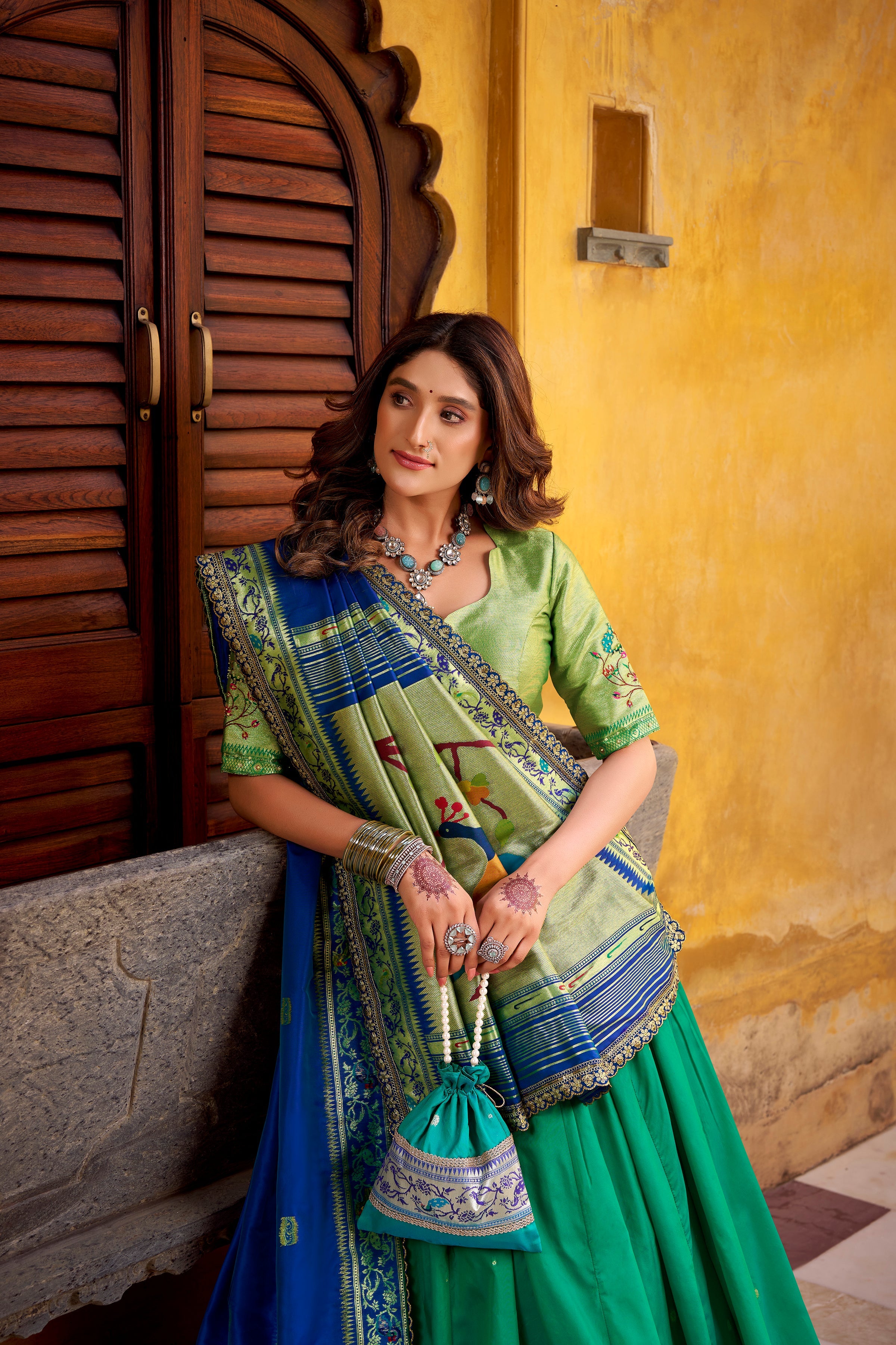 Hamsini teal soft silk Paithani lehenga choli with zari embroidered work