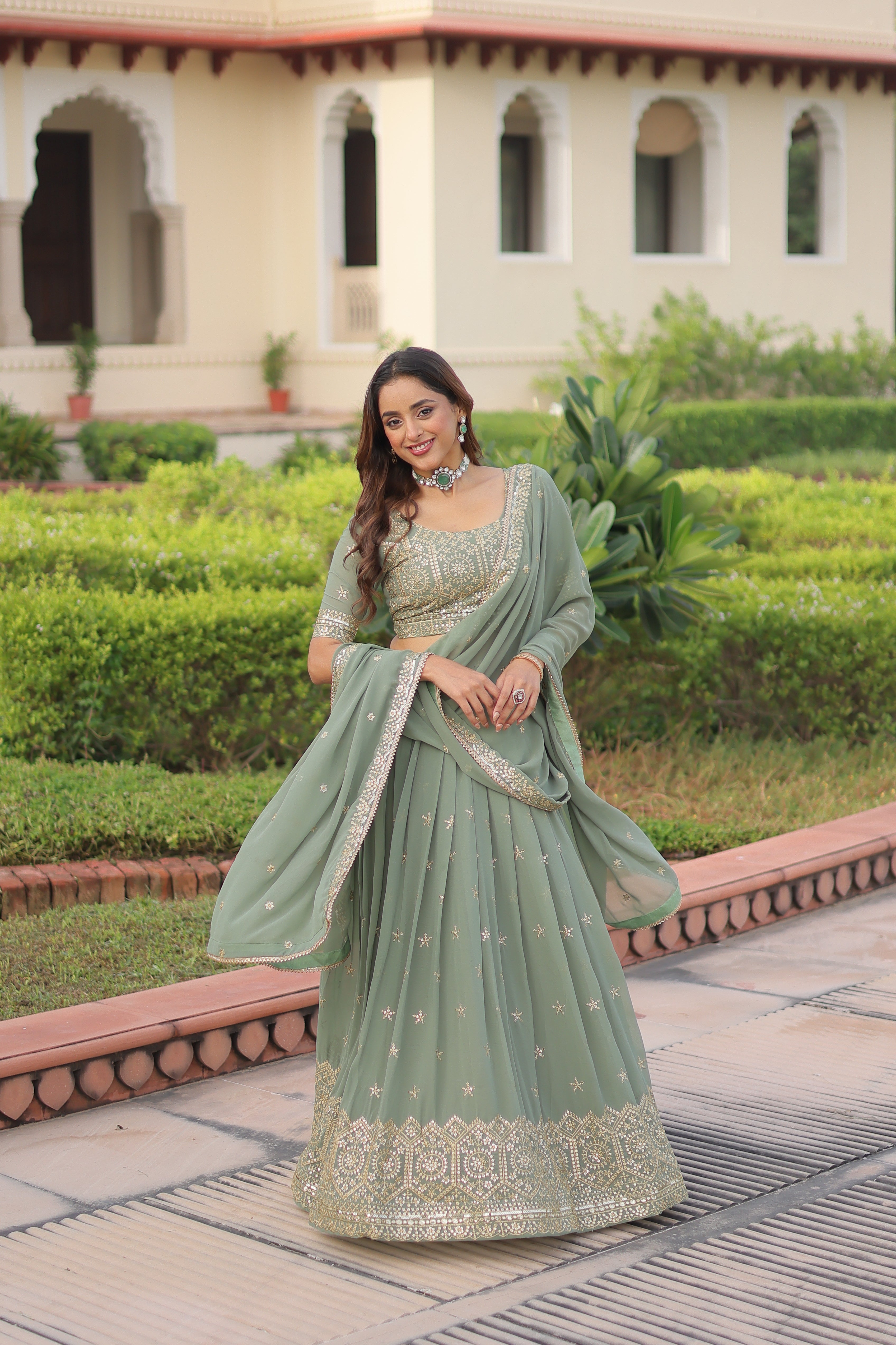 Invi pista green faux georgette lehenga choli with sequins zari embroidery