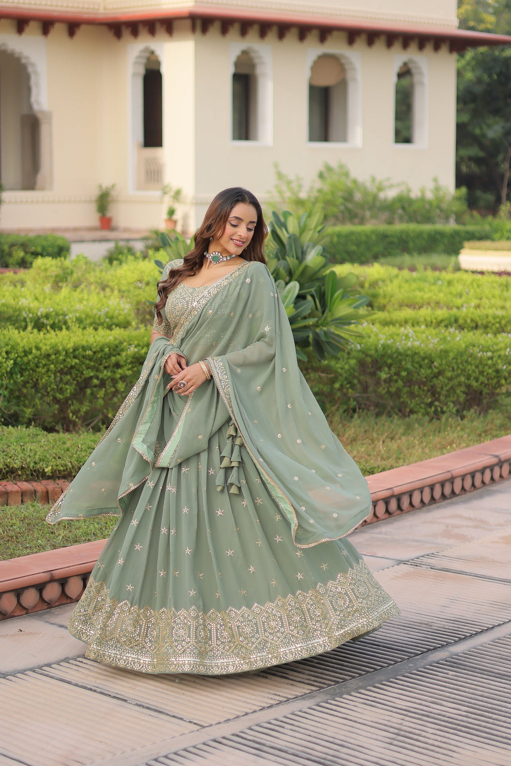 Invi pista green faux georgette lehenga choli with sequins zari embroidery