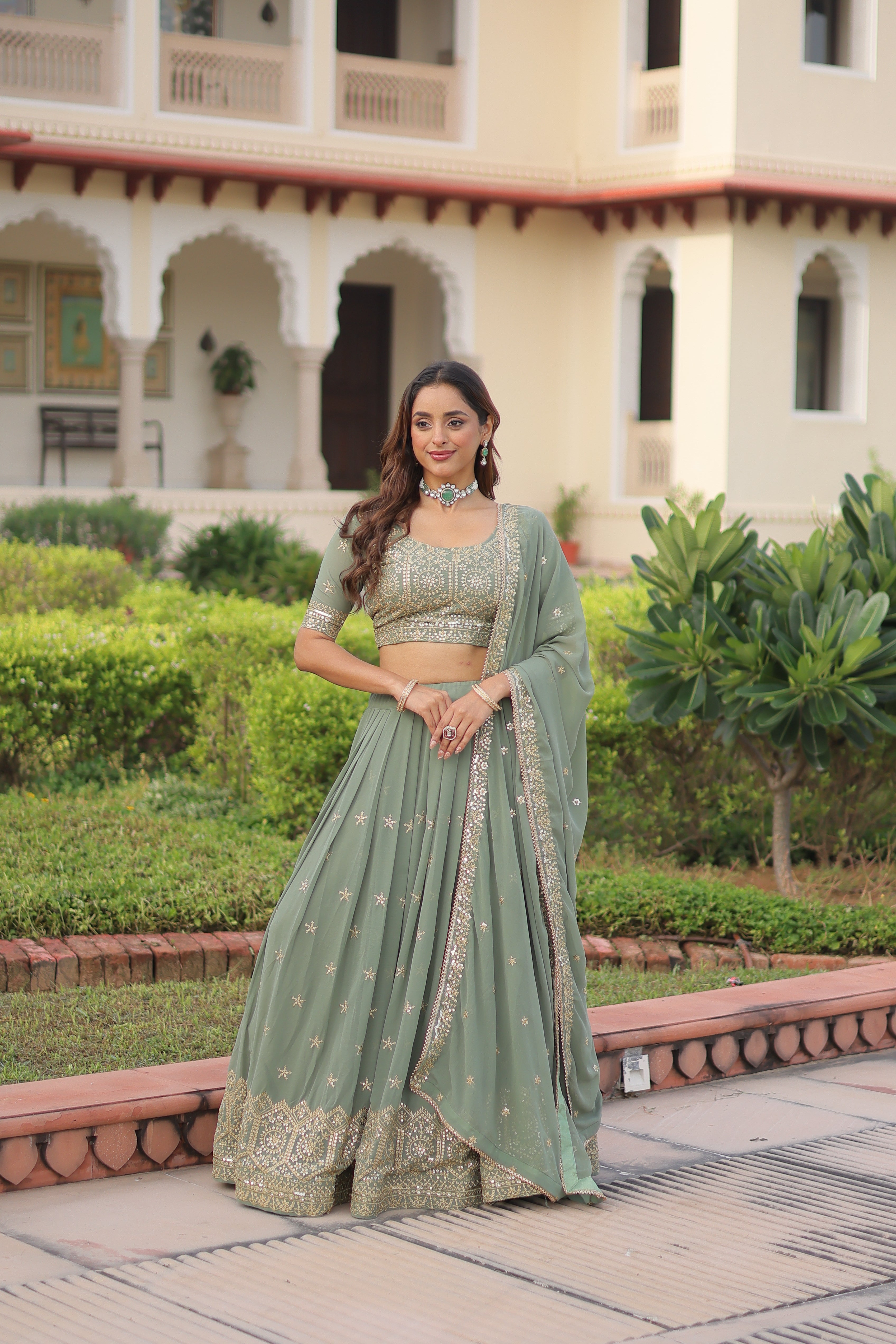 Invi pista green faux georgette lehenga choli with sequins zari embroidery