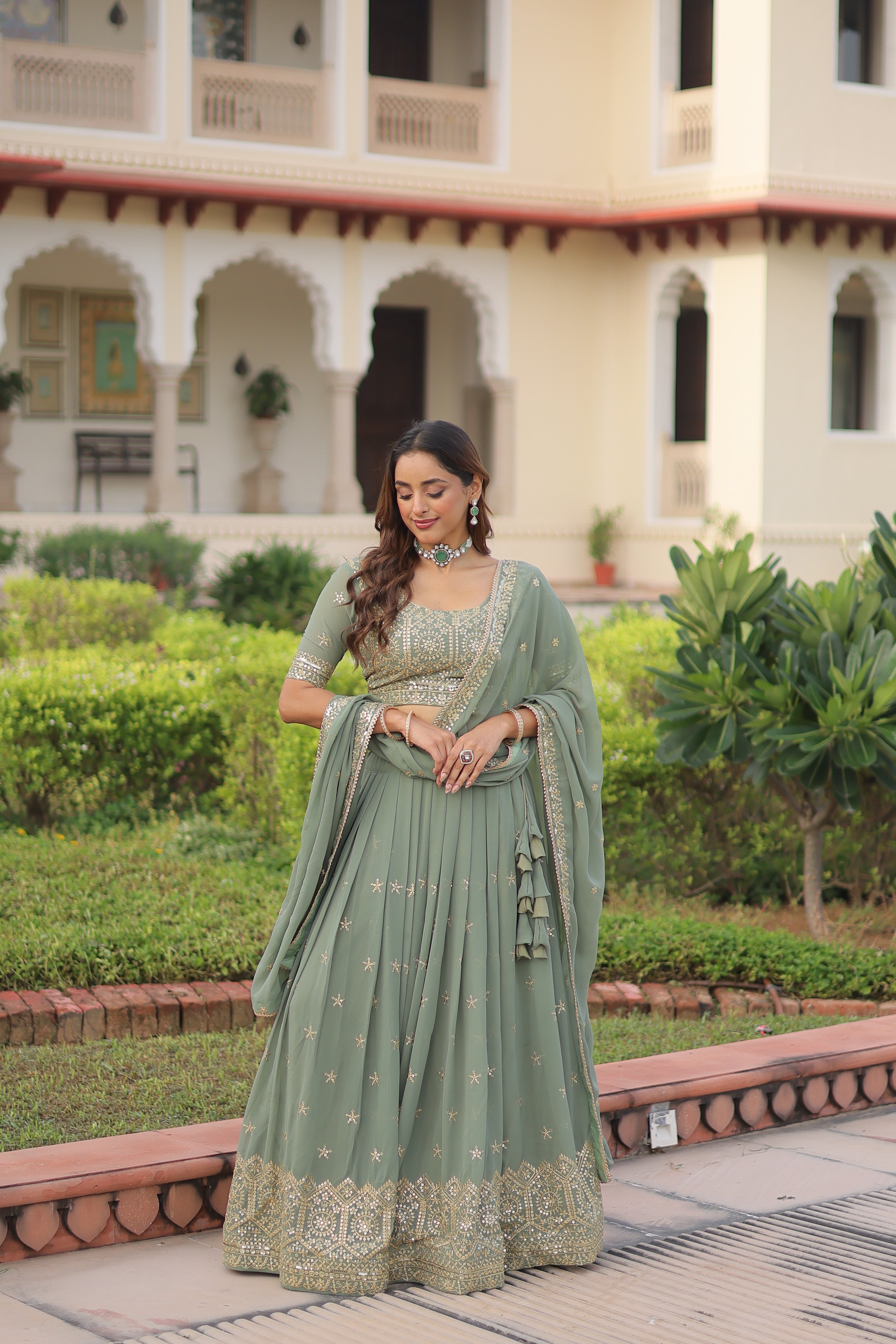 Invi pista green faux georgette lehenga choli with sequins zari embroidery