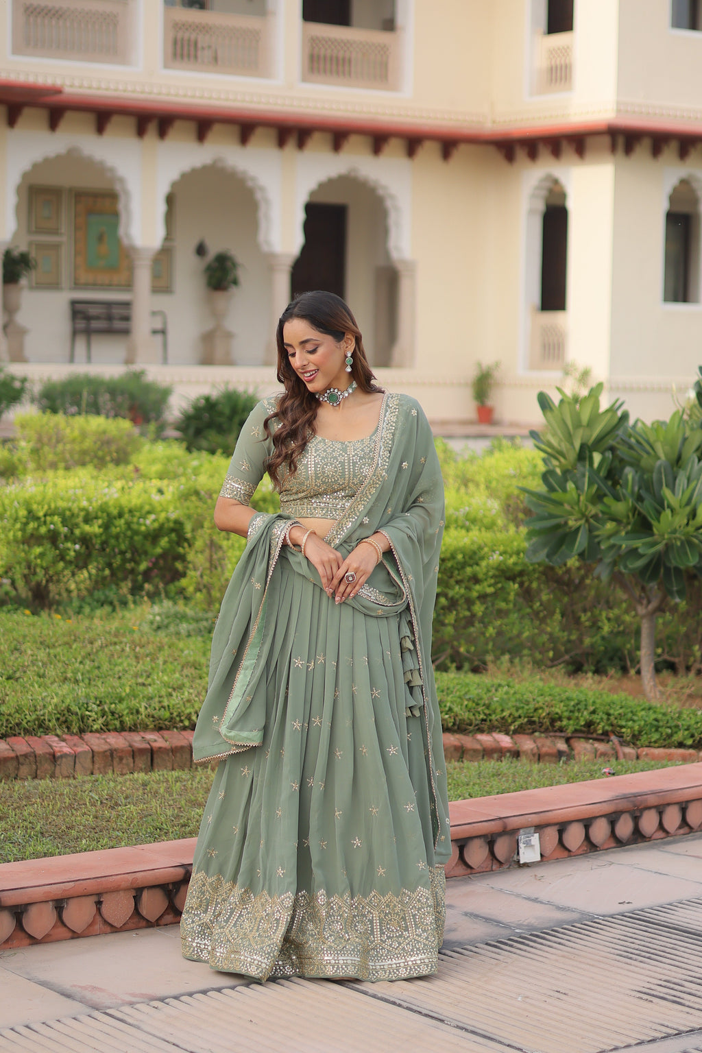 Invi pista green faux georgette lehenga choli with sequins zari embroidery