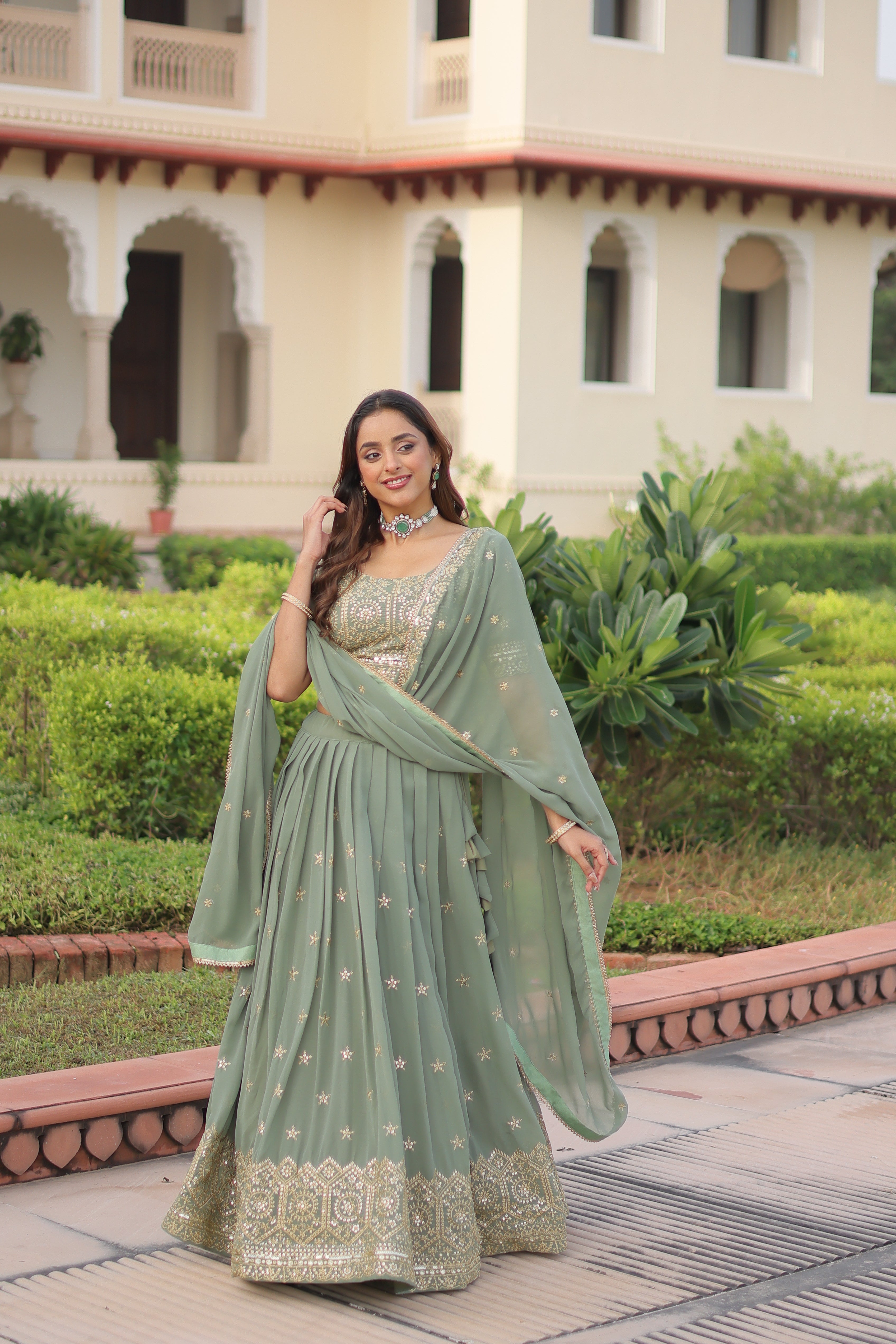 Invi pista green faux georgette lehenga choli with sequins zari embroidery