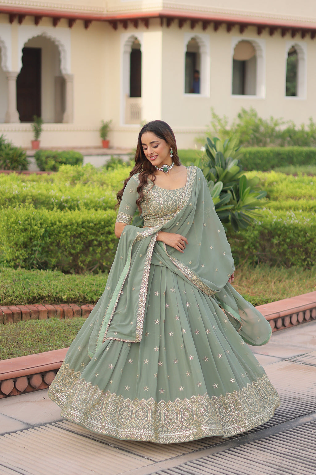 Invi pista green faux georgette lehenga choli with sequins zari embroidery