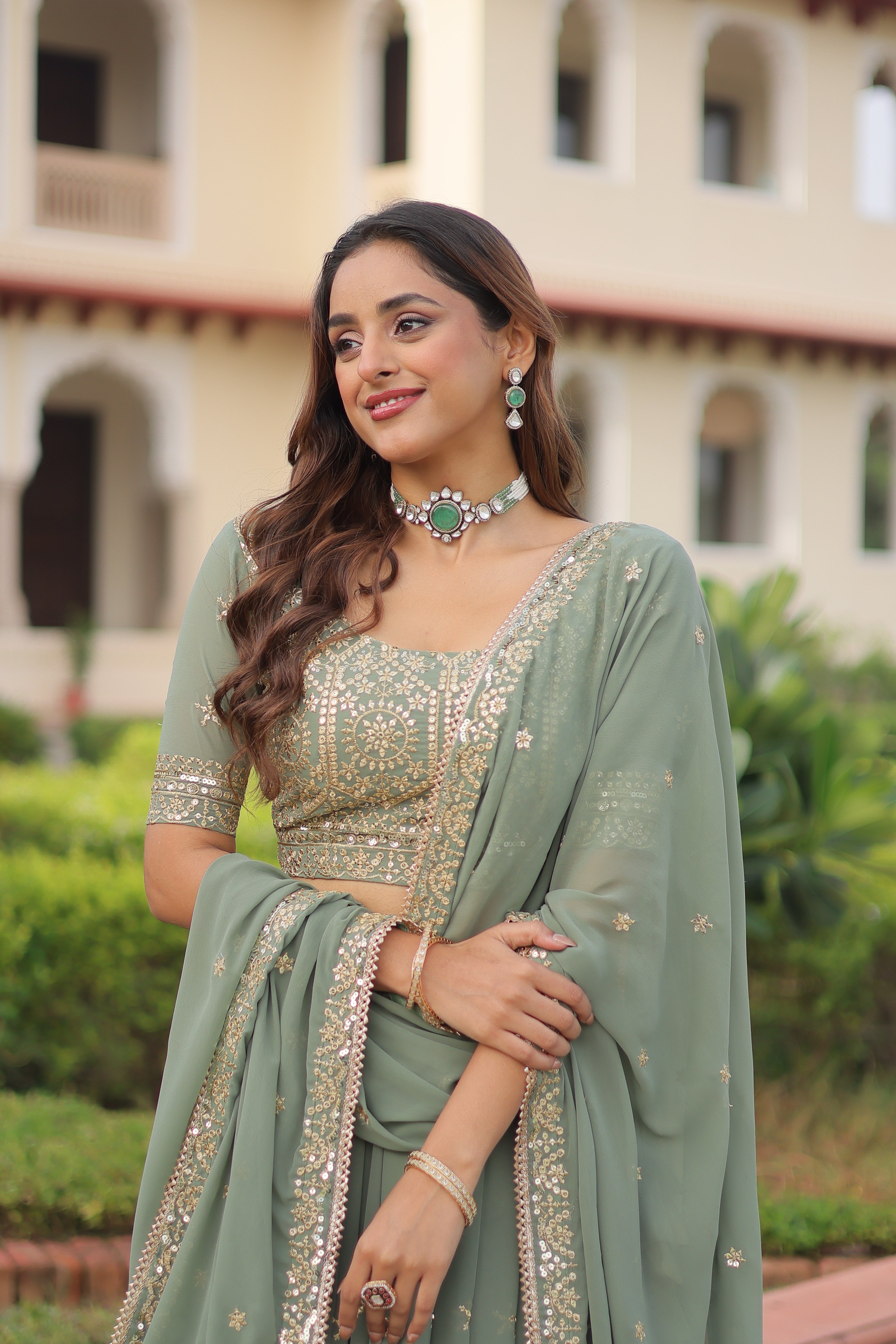 Invi pista green faux georgette lehenga choli with sequins zari embroidery