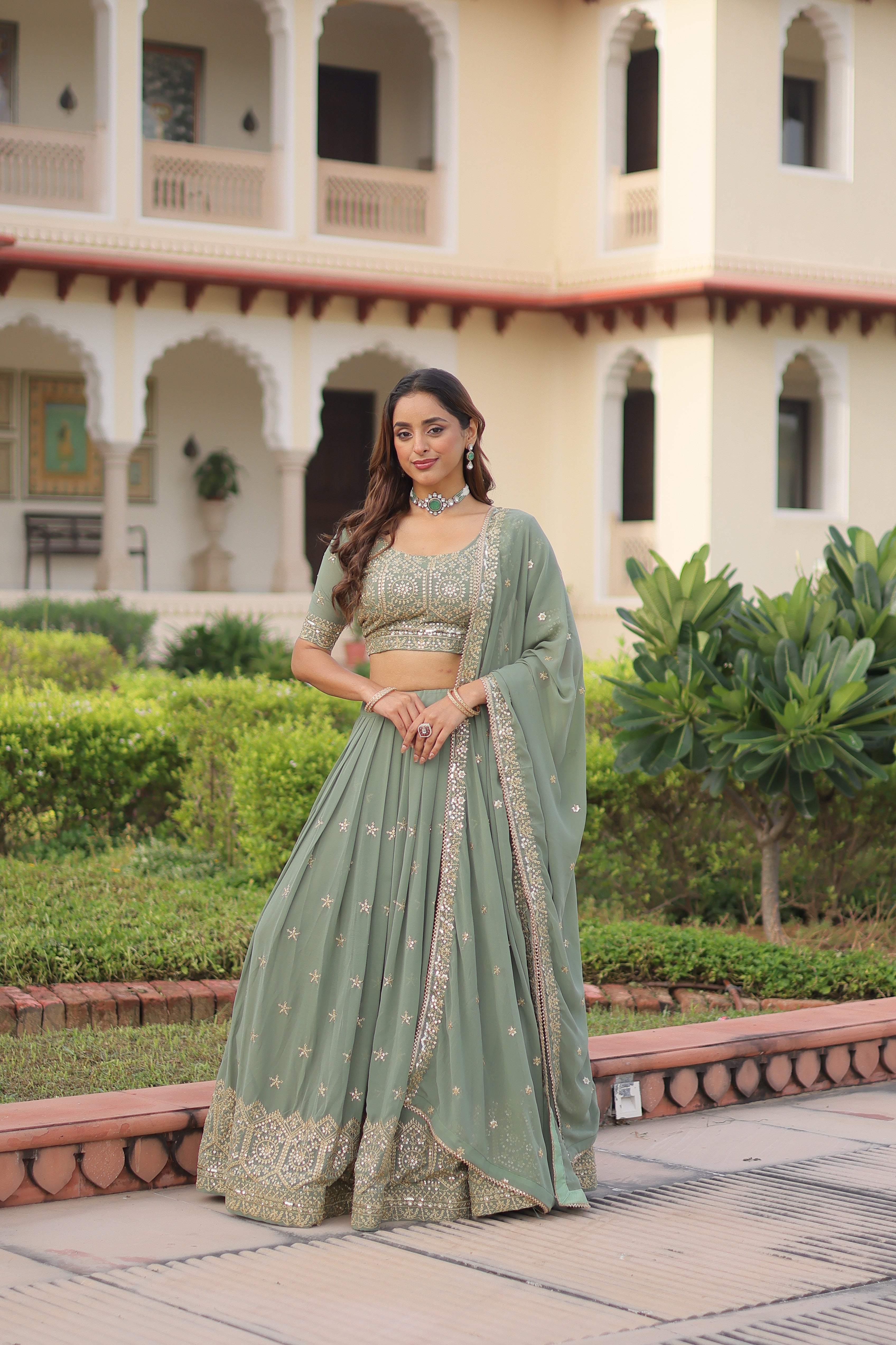 Invi pista green faux georgette lehenga choli with sequins zari embroidery