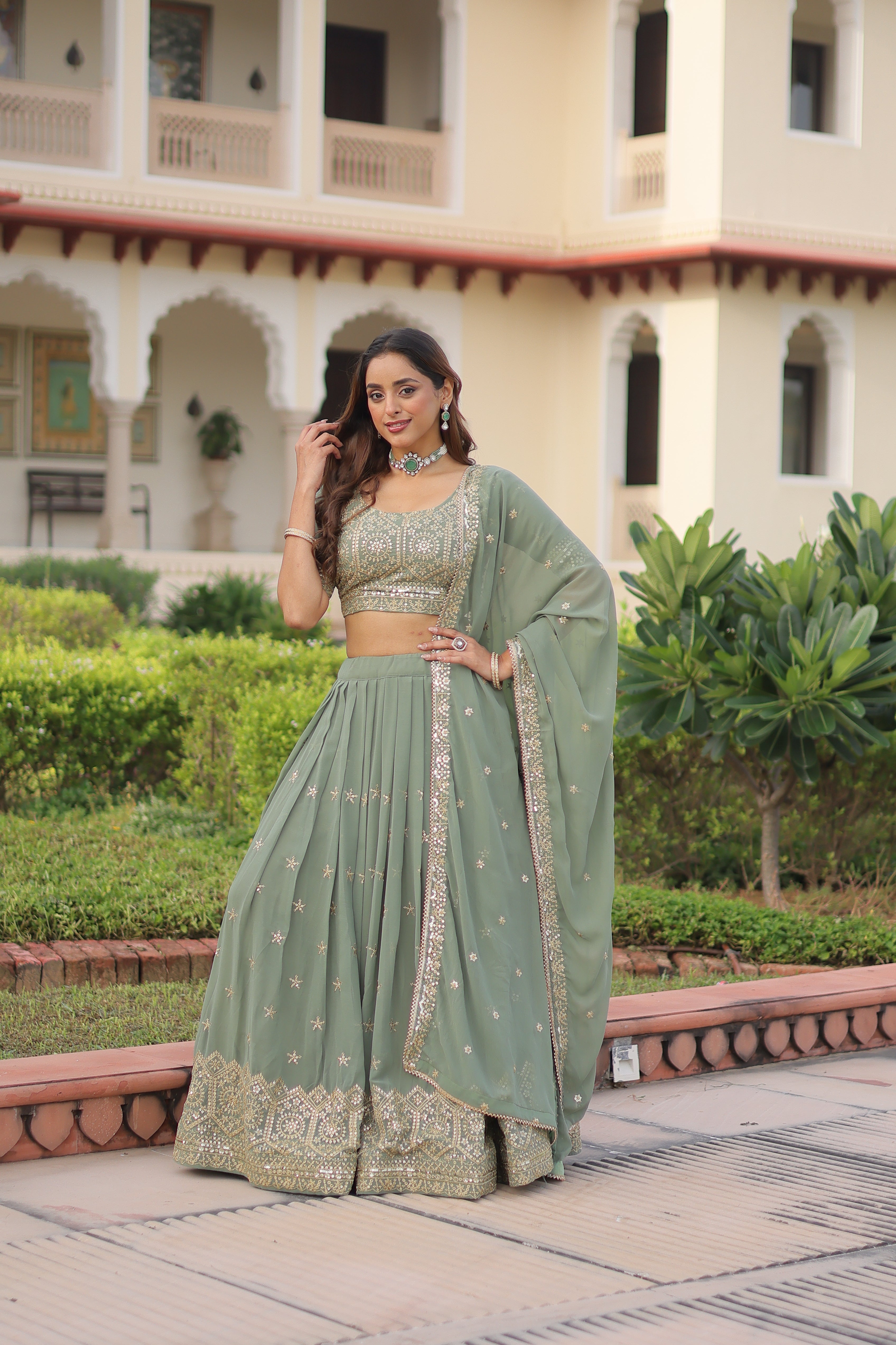 Invi pista green faux georgette lehenga choli with sequins zari embroidery