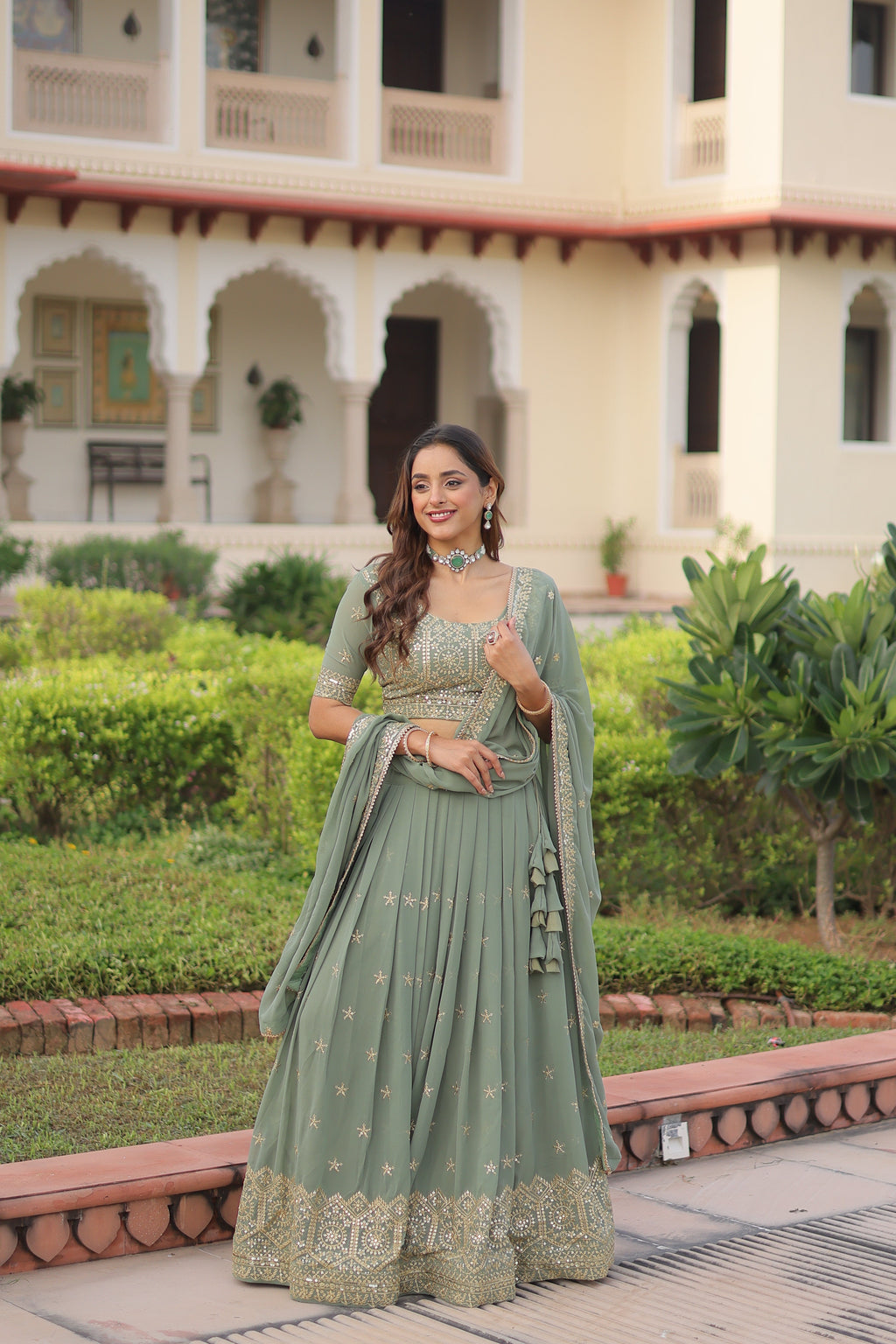 Invi pista green faux georgette lehenga choli with sequins zari embroidery
