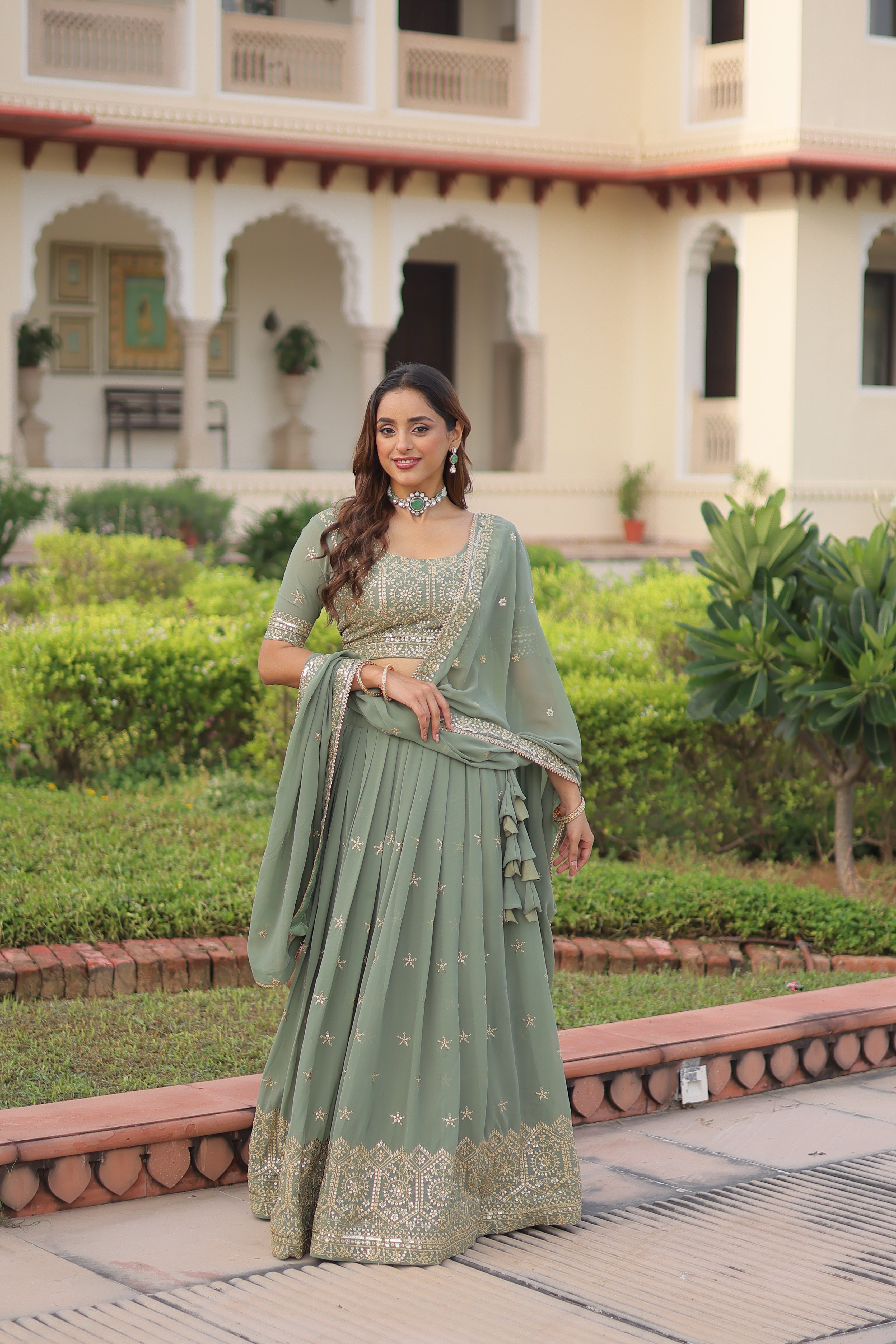 Invi pista green faux georgette lehenga choli with sequins zari embroidery