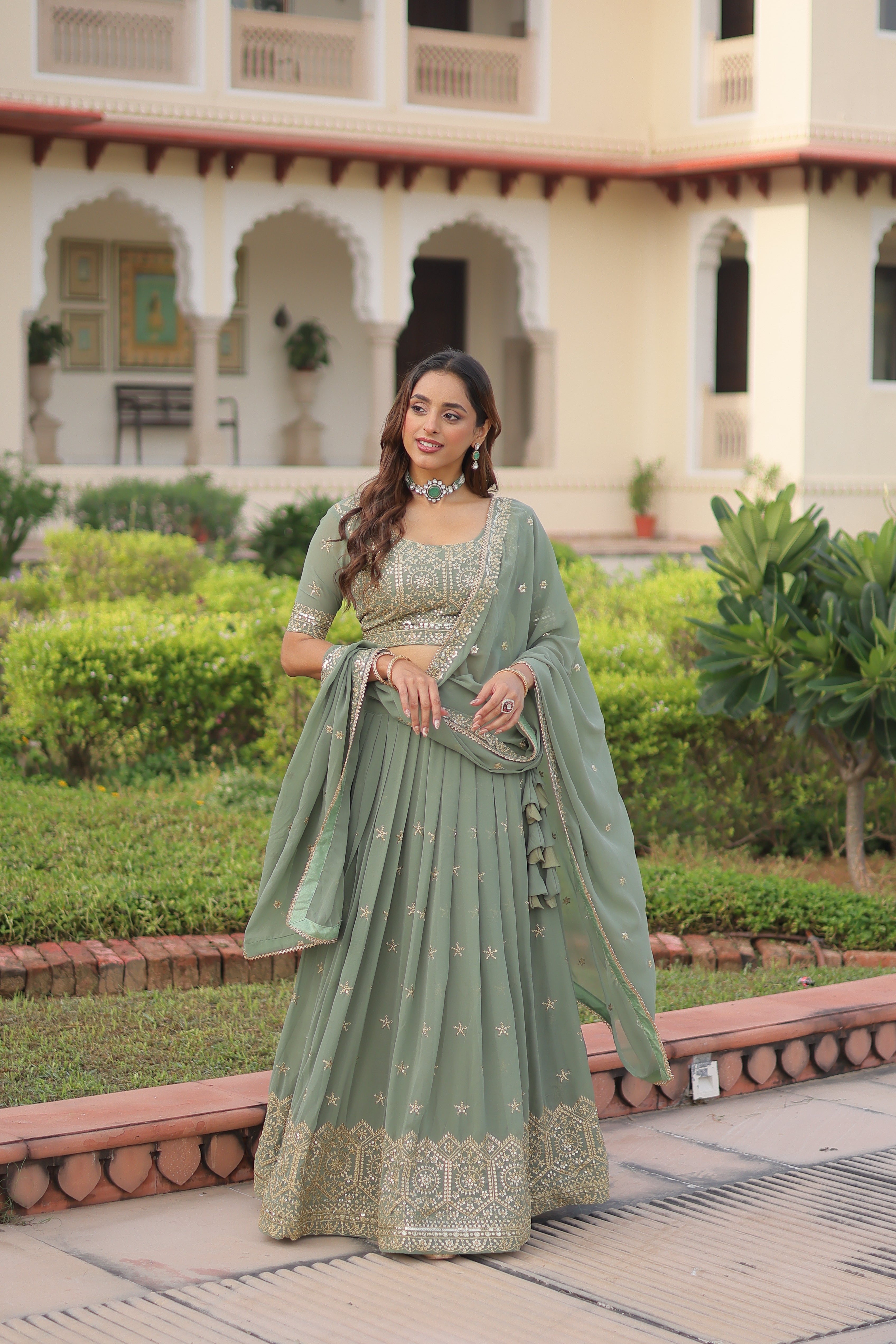 Invi pista green faux georgette lehenga choli with sequins zari embroidery