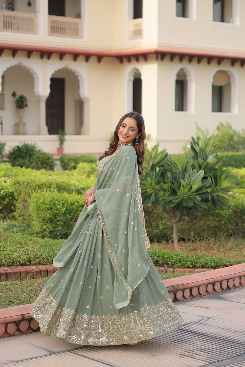Invi pista green faux georgette lehenga choli with sequins zari embroidery