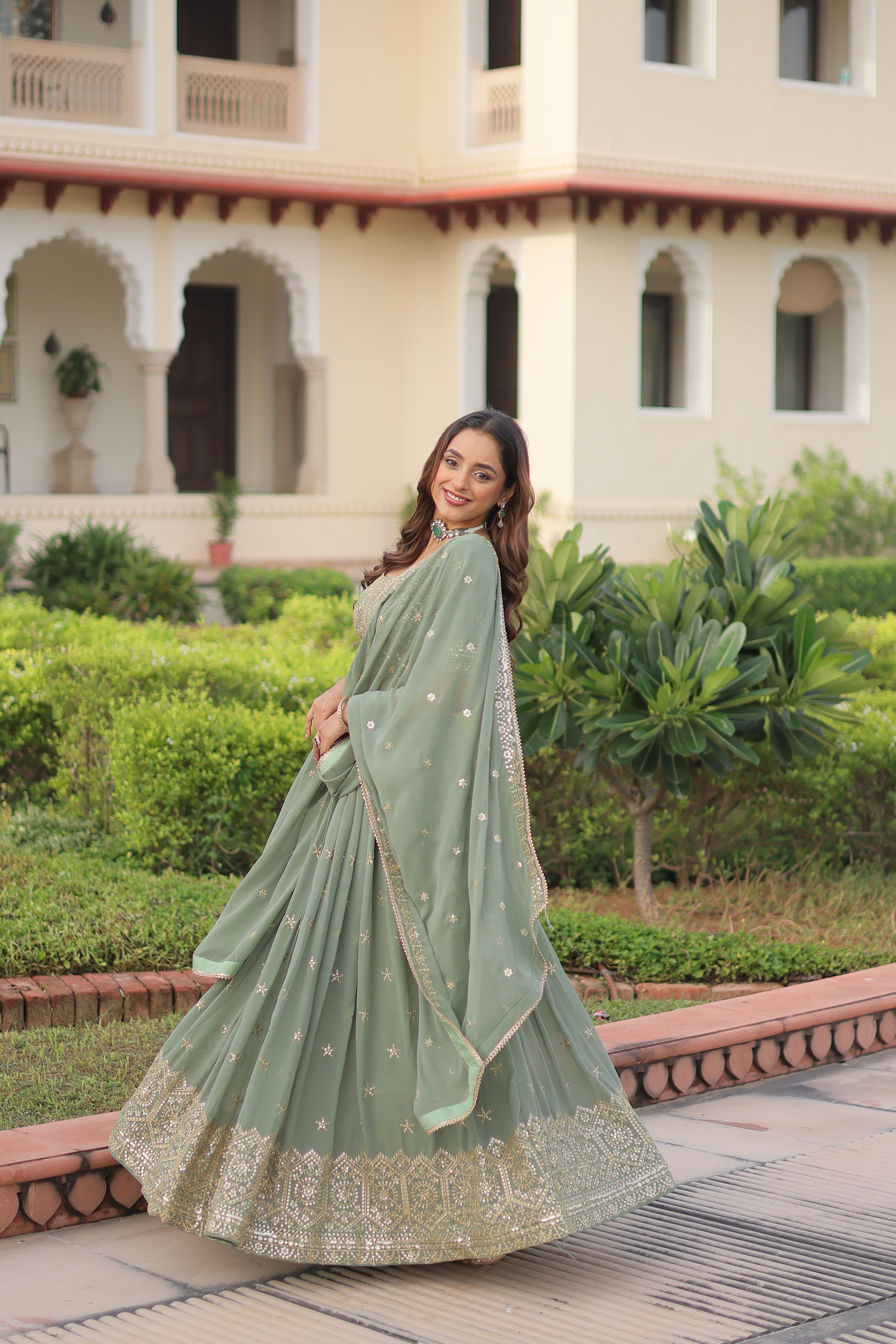 Invi pista green faux georgette lehenga choli with sequins zari embroidery