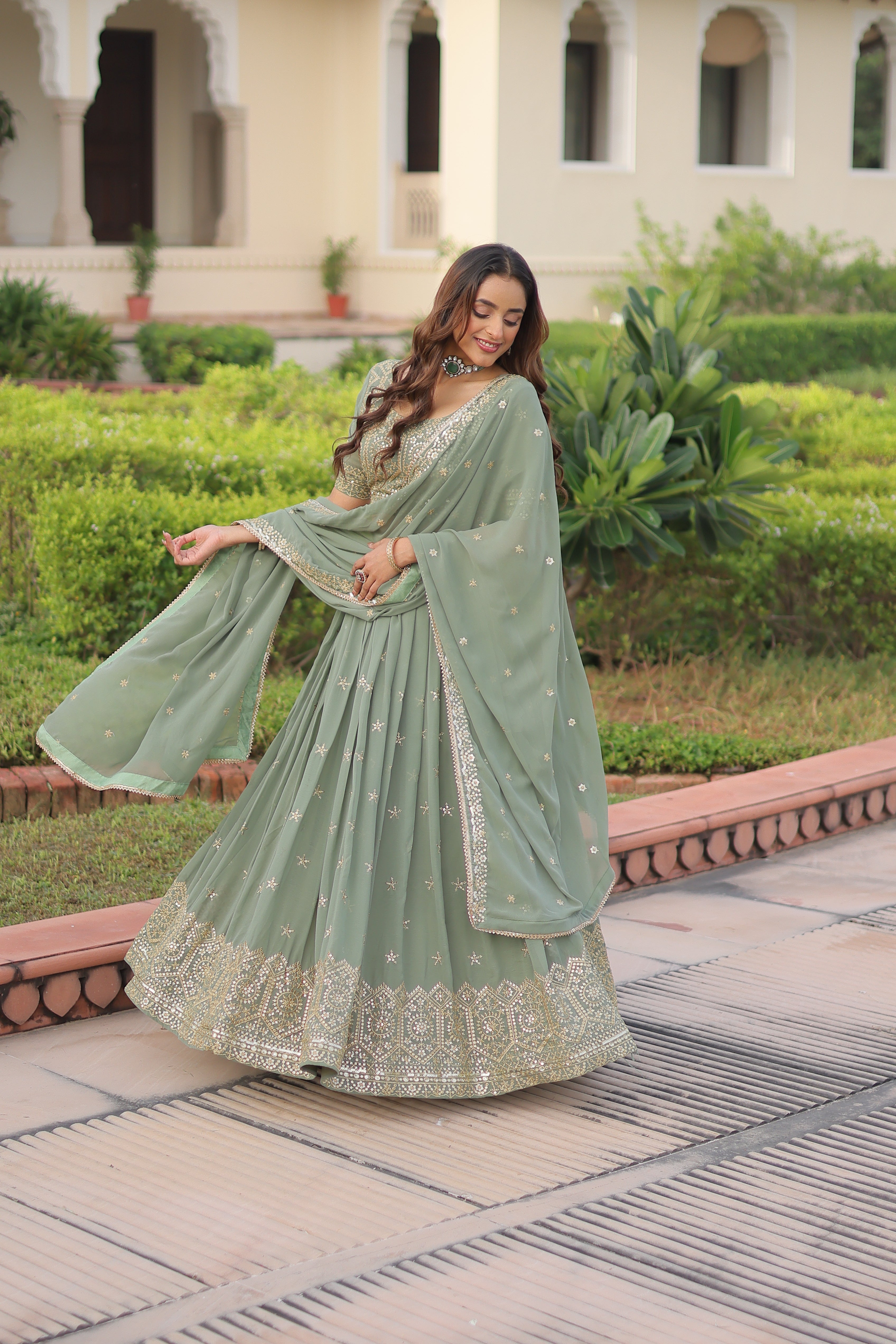 Invi pista green faux georgette lehenga choli with sequins zari embroidery