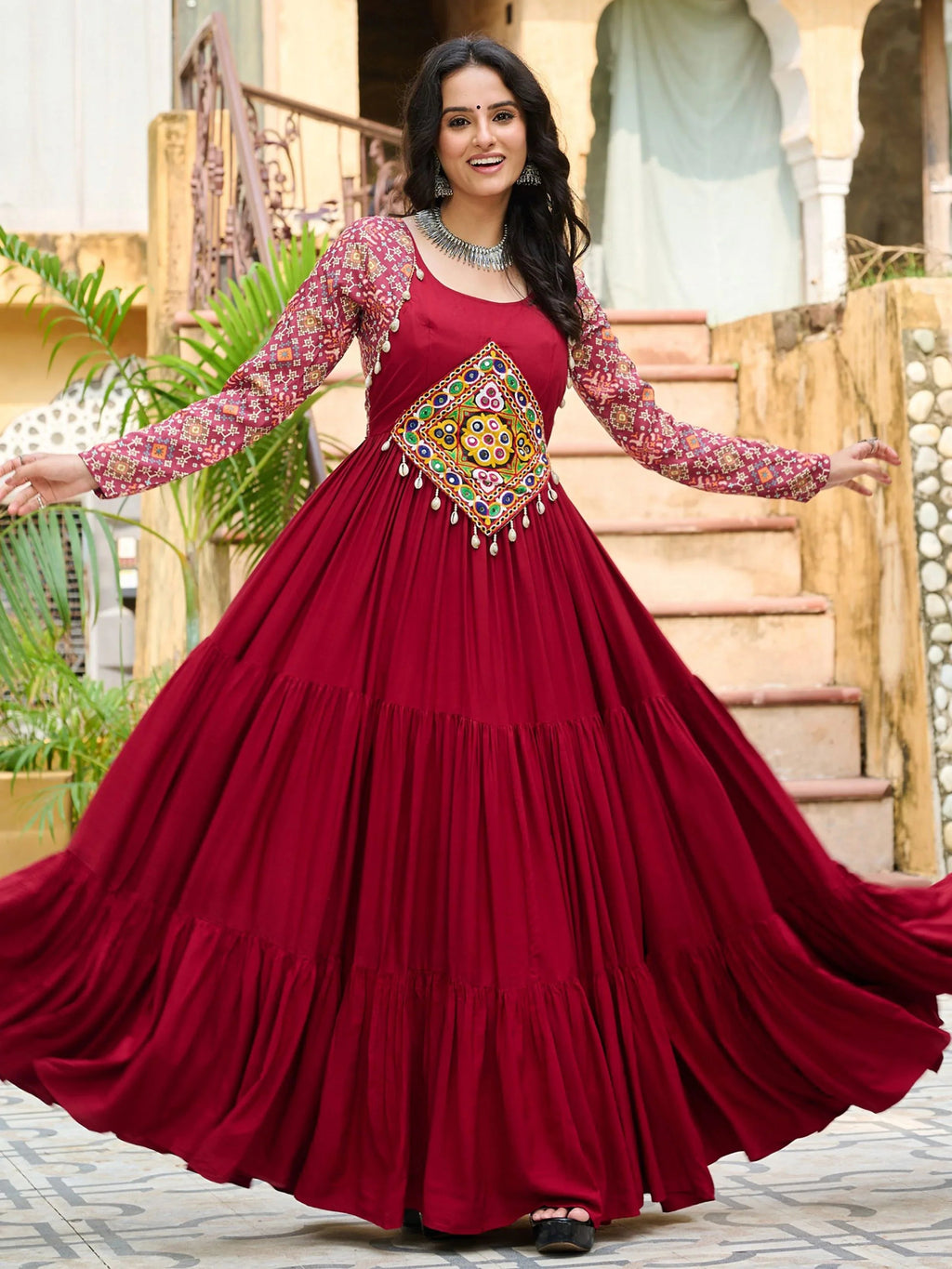 Maroon pure rayon flair gown with kutchi gamthi embroidery