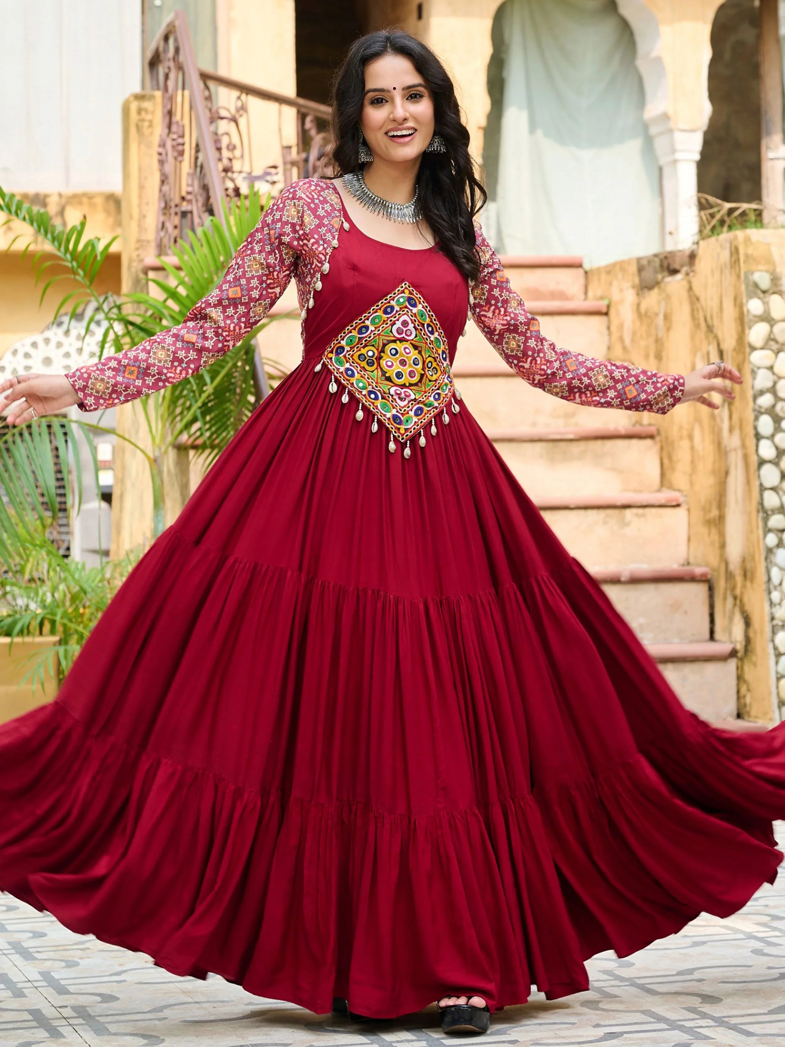 Maroon pure rayon flair gown with kutchi gamthi embroidery