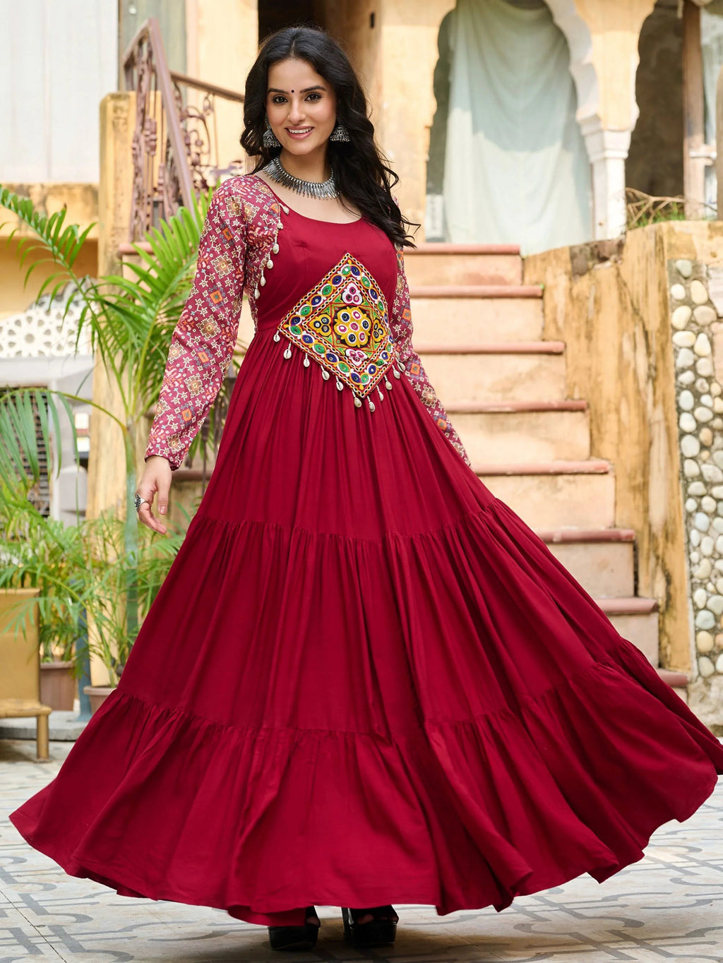 Maroon pure rayon flair gown with kutchi gamthi embroidery