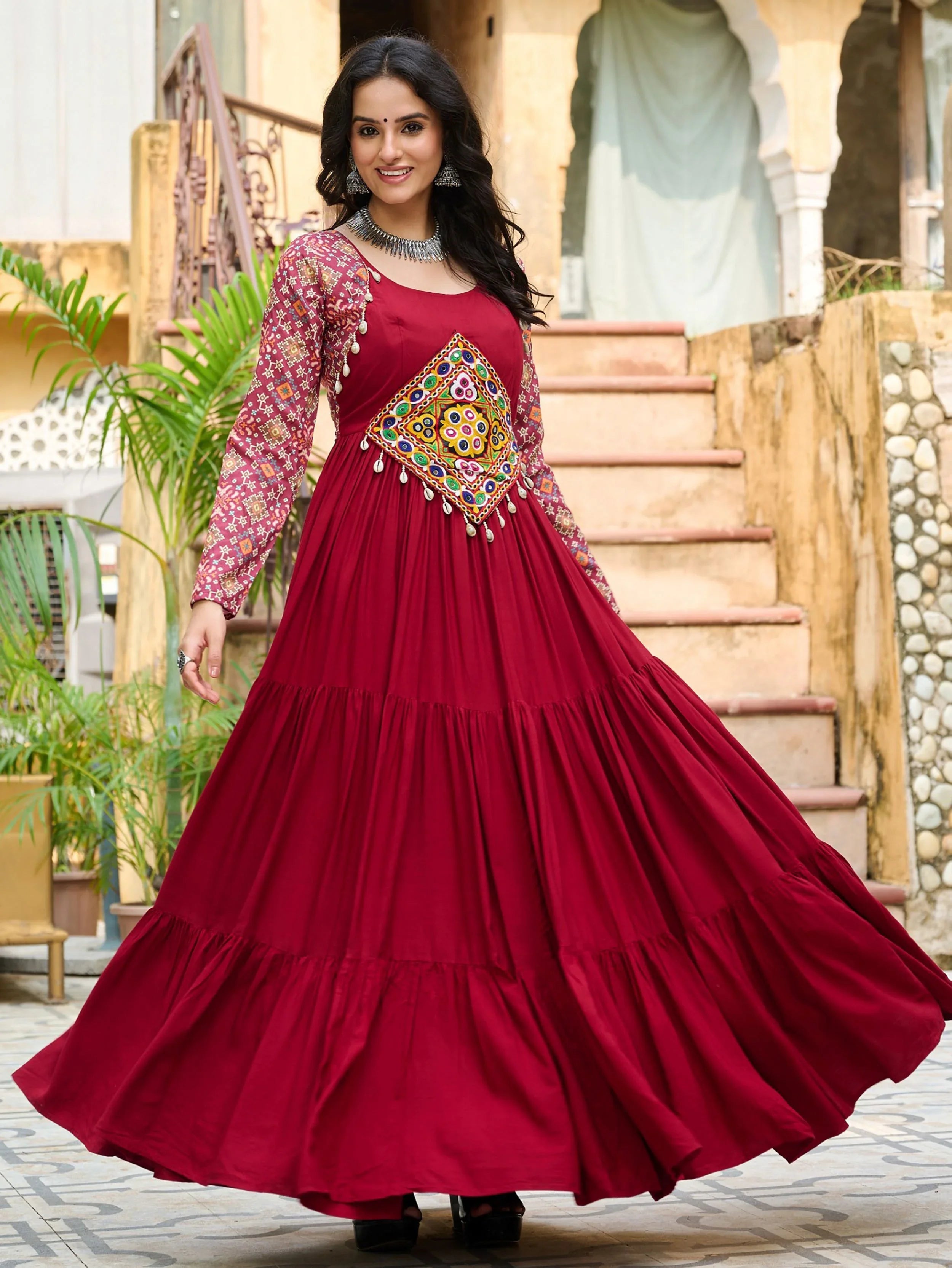Maroon pure rayon flair gown with kutchi gamthi embroidery