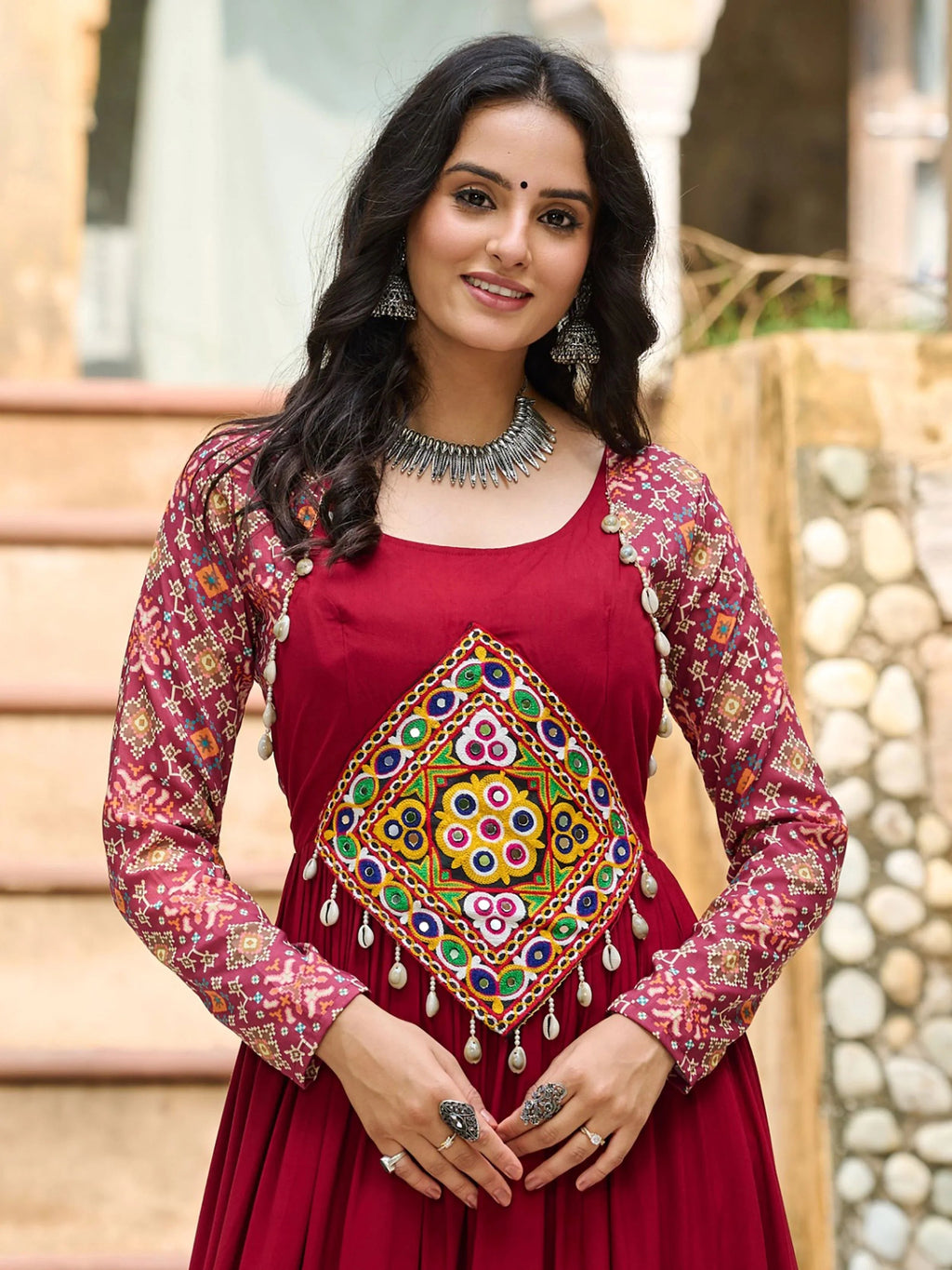 Maroon pure rayon flair gown with kutchi gamthi embroidery