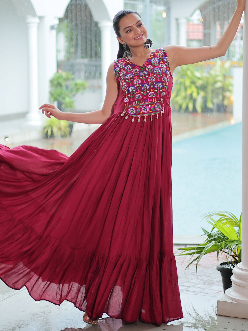 Maroon rayon sleeveless gown with kutchi gamthi embroidery and mirror work