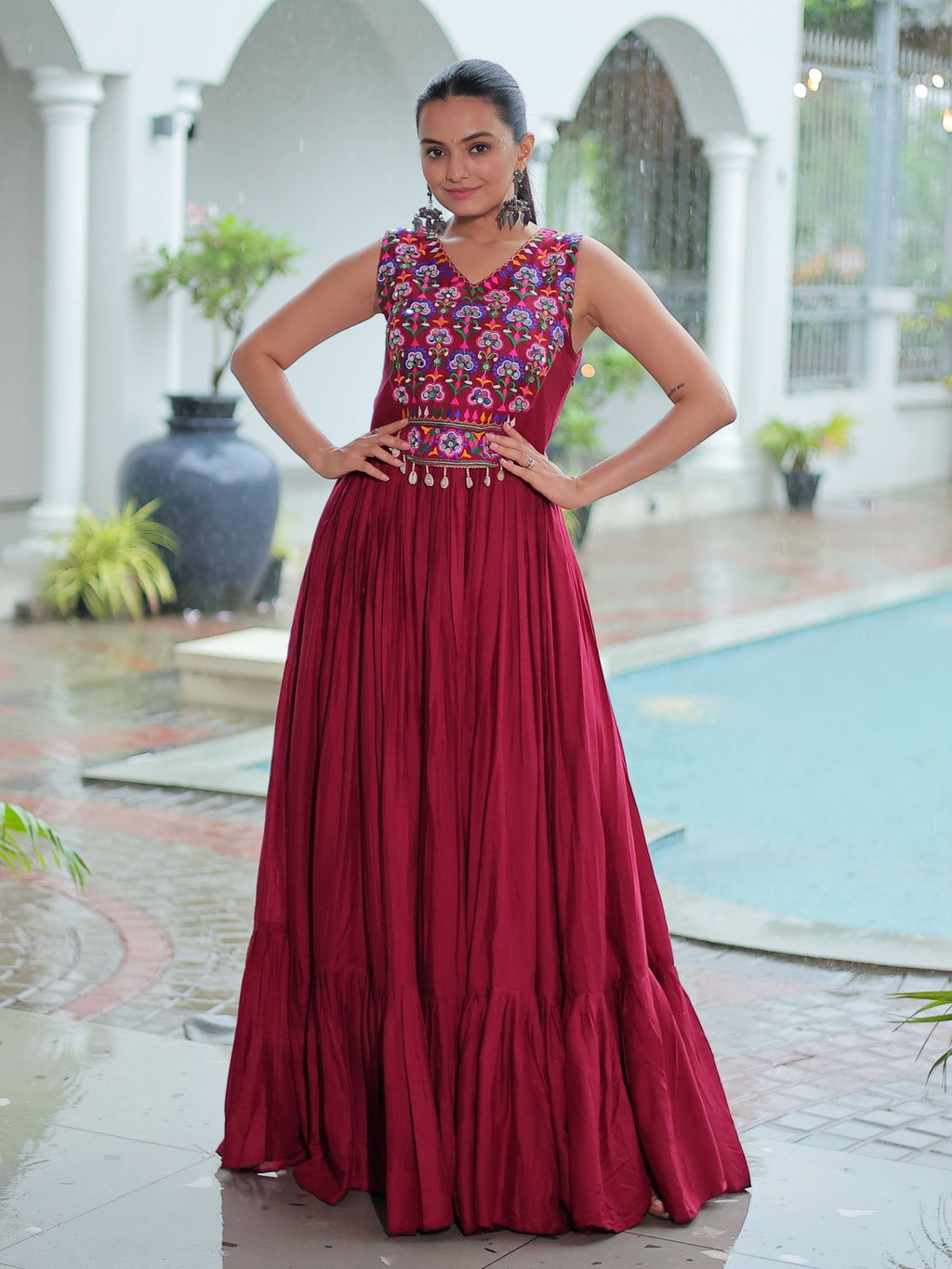 Maroon rayon sleeveless gown with kutchi gamthi embroidery and mirror work