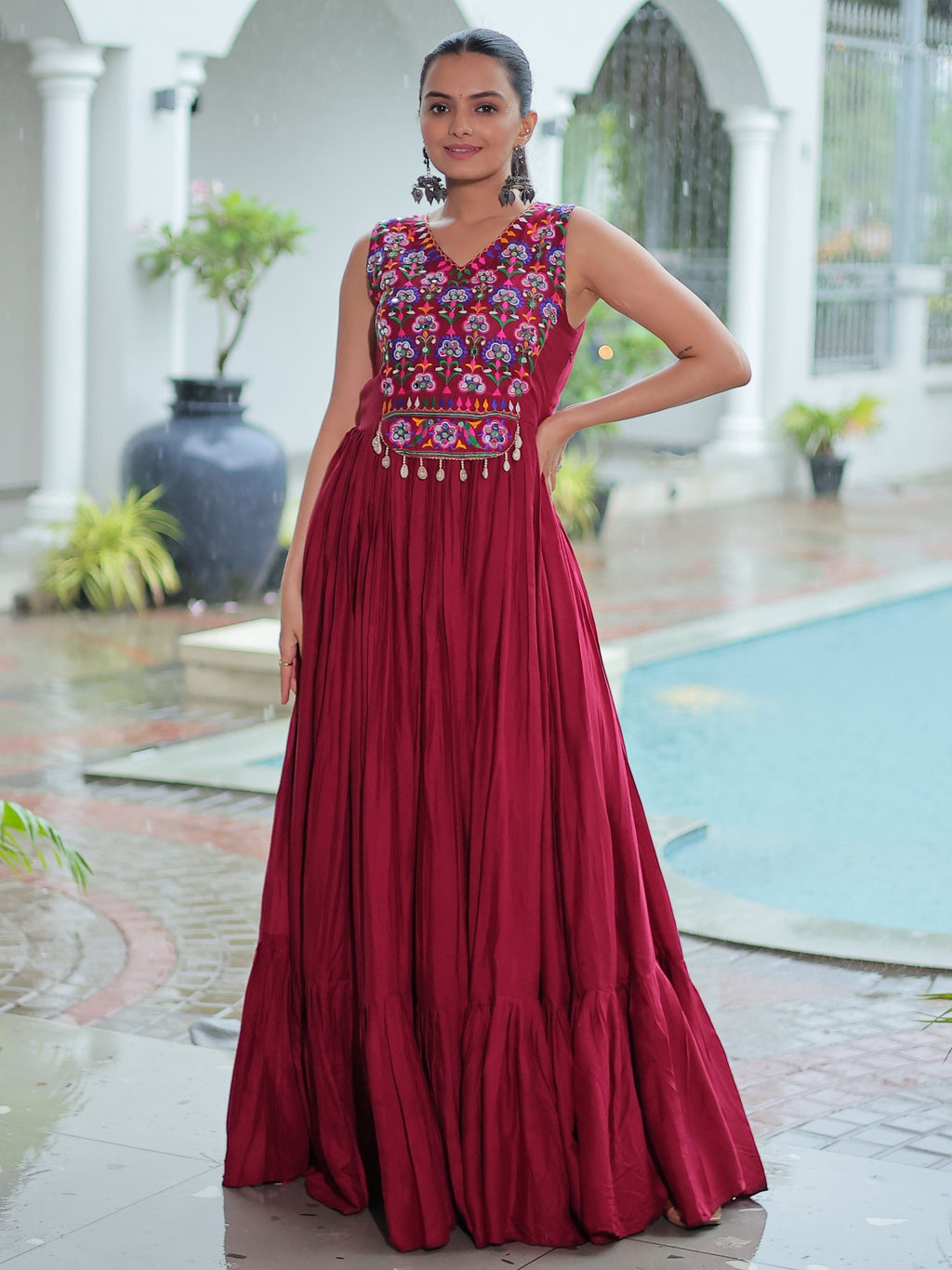 Maroon rayon sleeveless gown with kutchi gamthi embroidery and mirror work