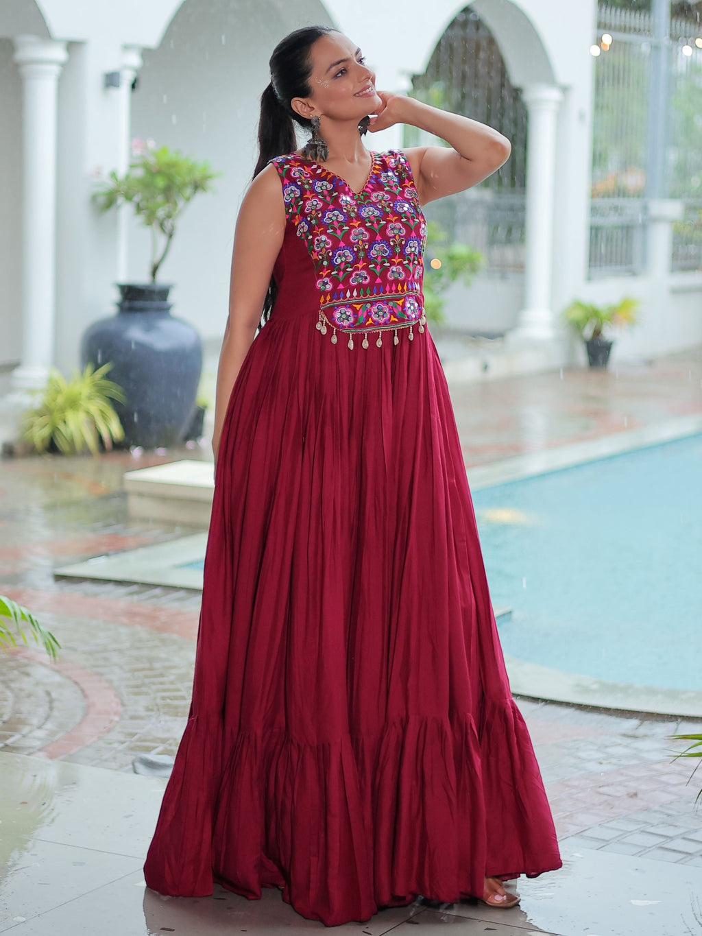 Maroon rayon sleeveless gown with kutchi gamthi embroidery and mirror work