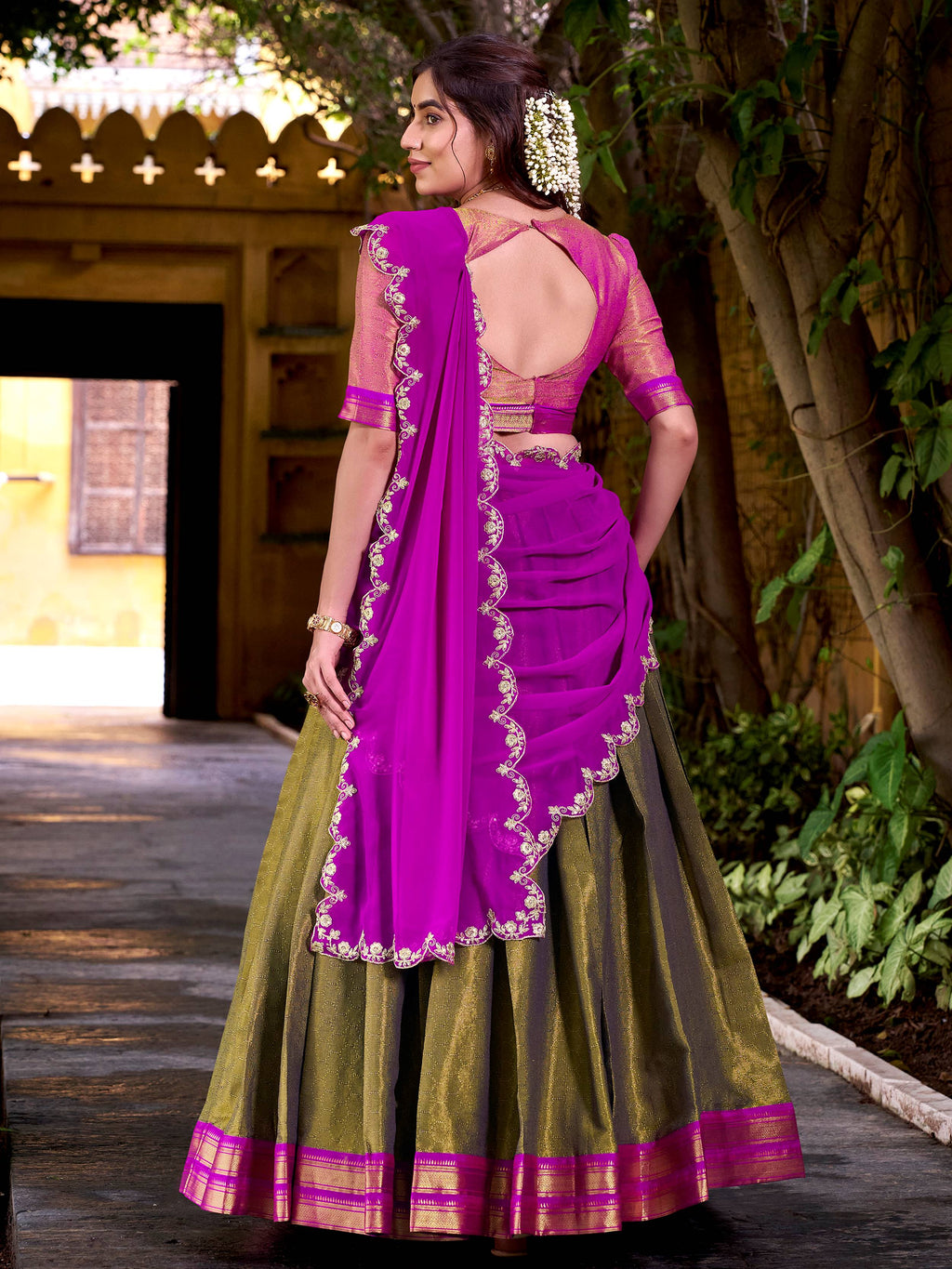 Mehendi green kanchipuram silk lehenga choli with zari weaving and sequins work
