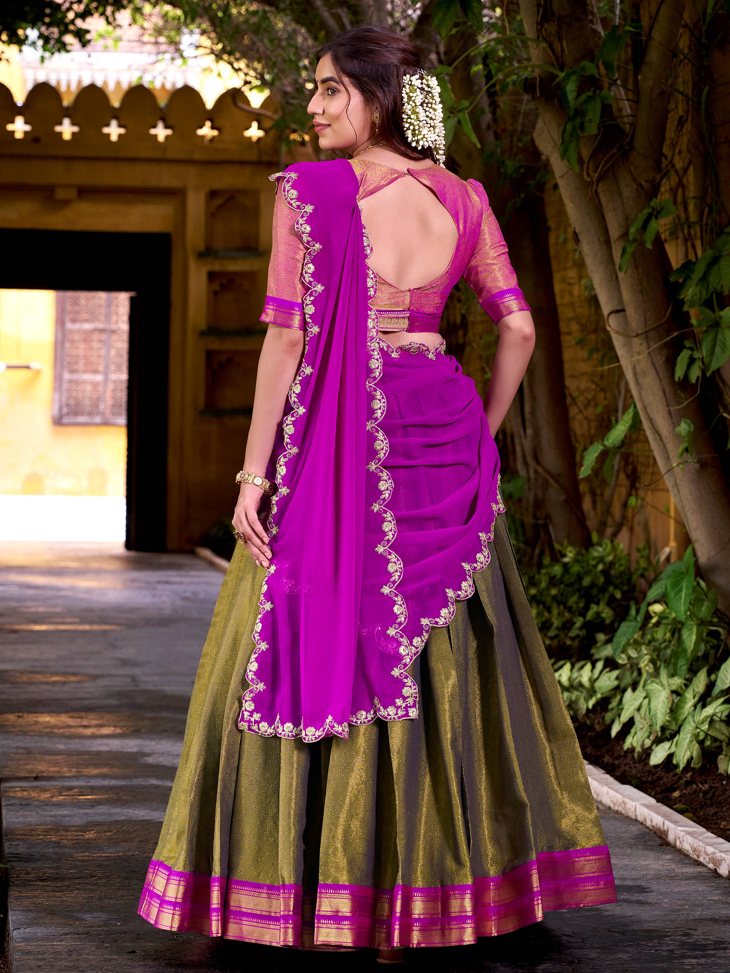 Mehendi green kanchipuram silk lehenga choli with zari weaving and sequins work
