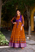 Mustard yellow poly cotton Kalamkari print gown with zari weaving koti