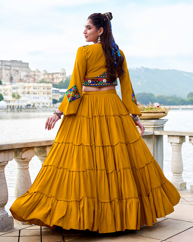 Mustard yellow rayon lehenga set with mirror embroidered blouse and koti