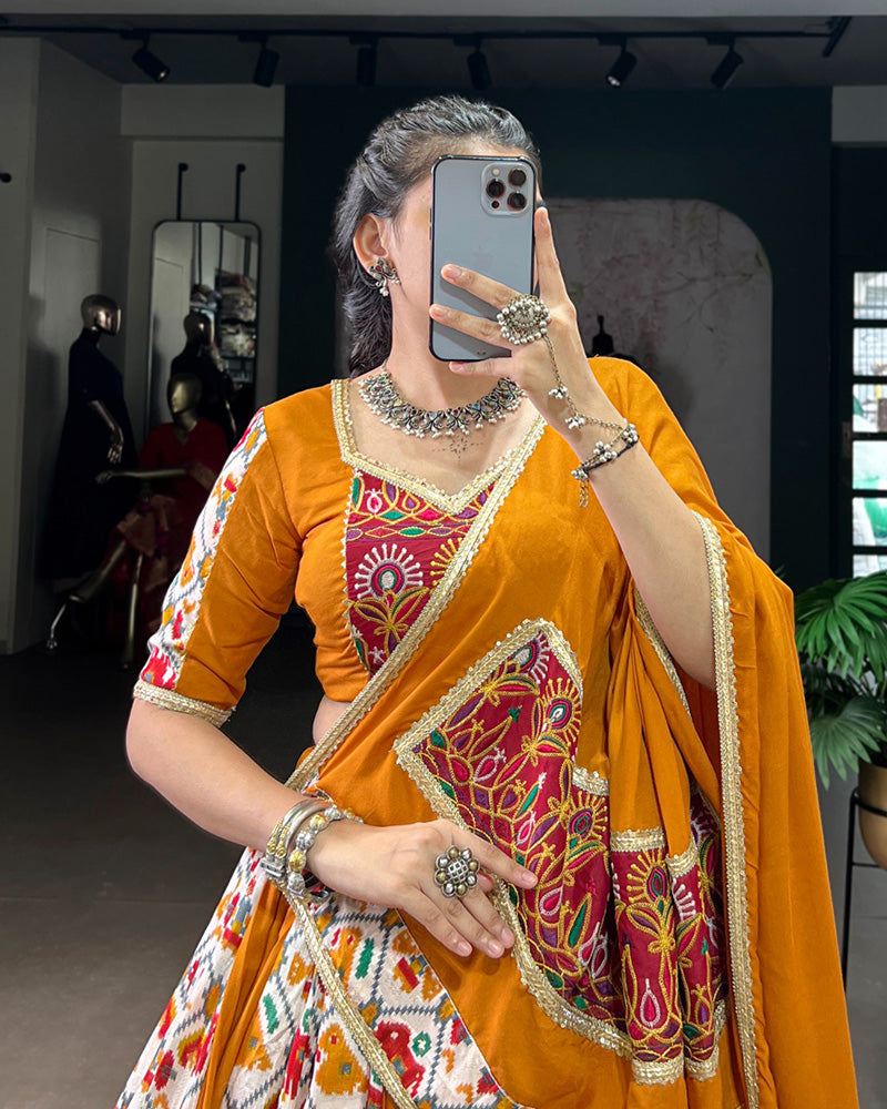 Mustard yellow rayon silk Patola print Gamthi work lehenga choli