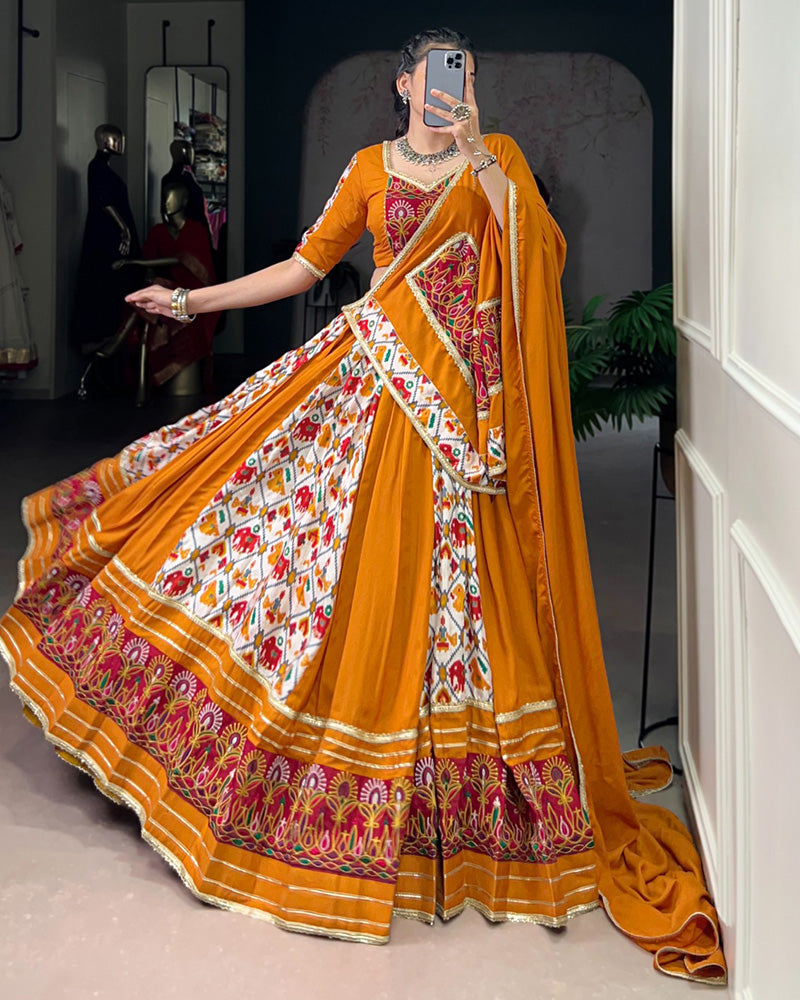 Mustard yellow rayon silk Patola print Gamthi work lehenga choli