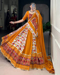 Mustard yellow rayon silk Patola print Gamthi work lehenga choli