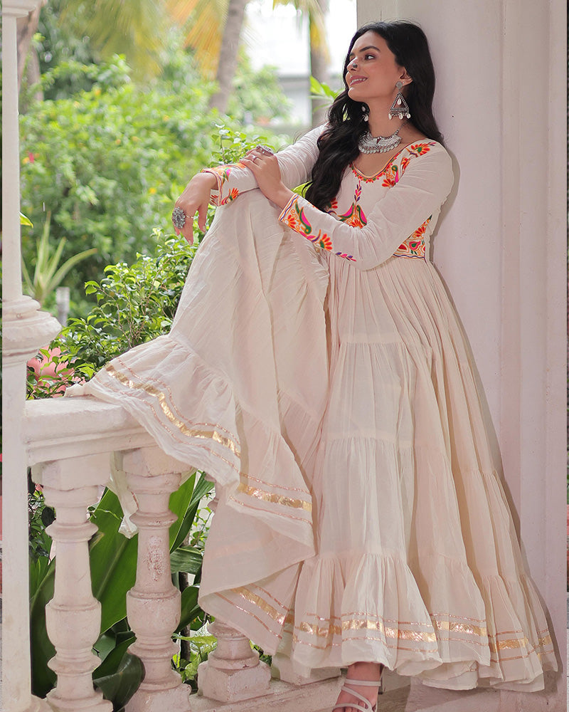 Off-white cotton flared gown with thread embroidery and Gota Patti work