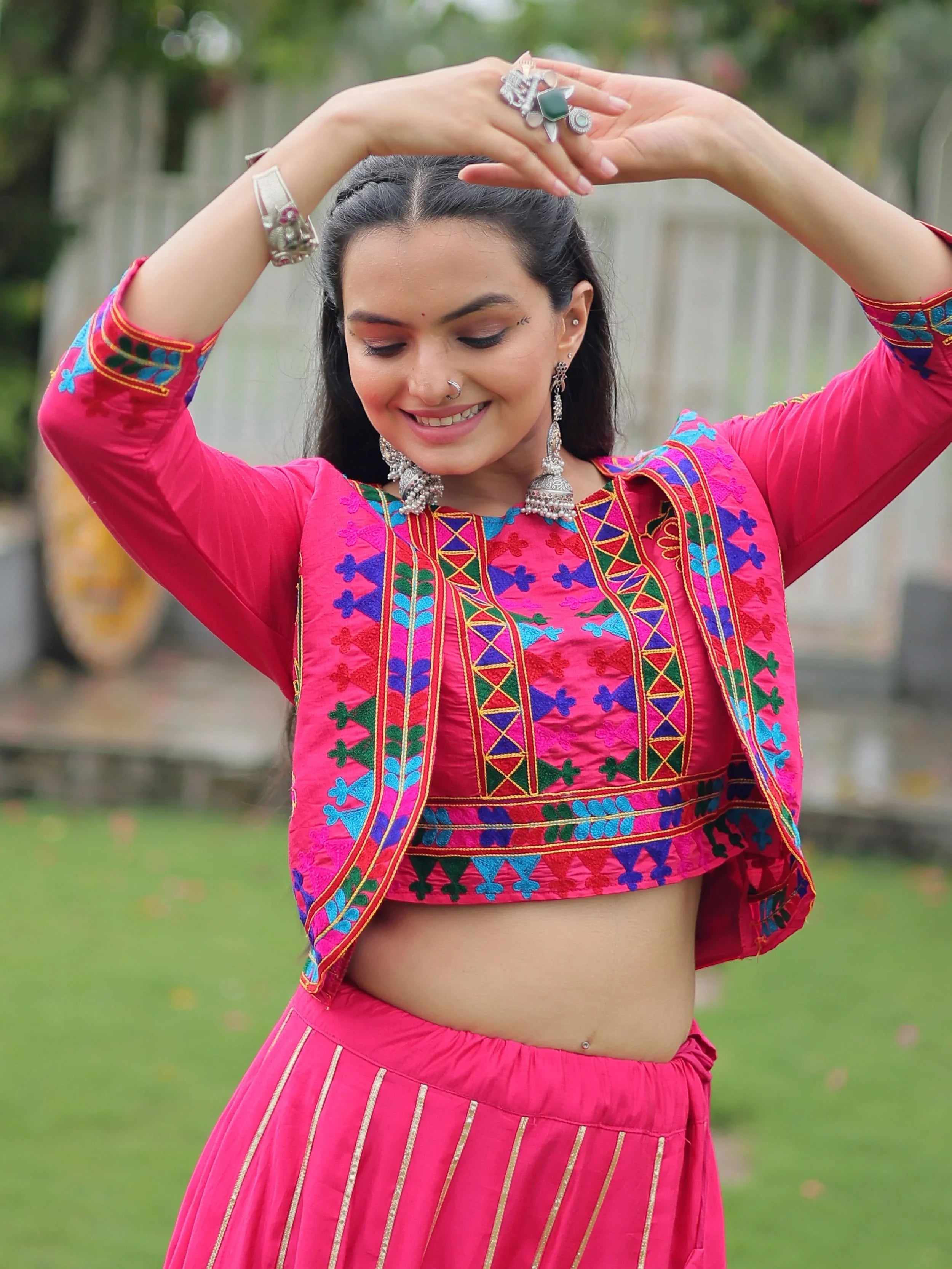 Pink lehenga choli with Kutchi Gamthi embroidery and Gota Patti lace